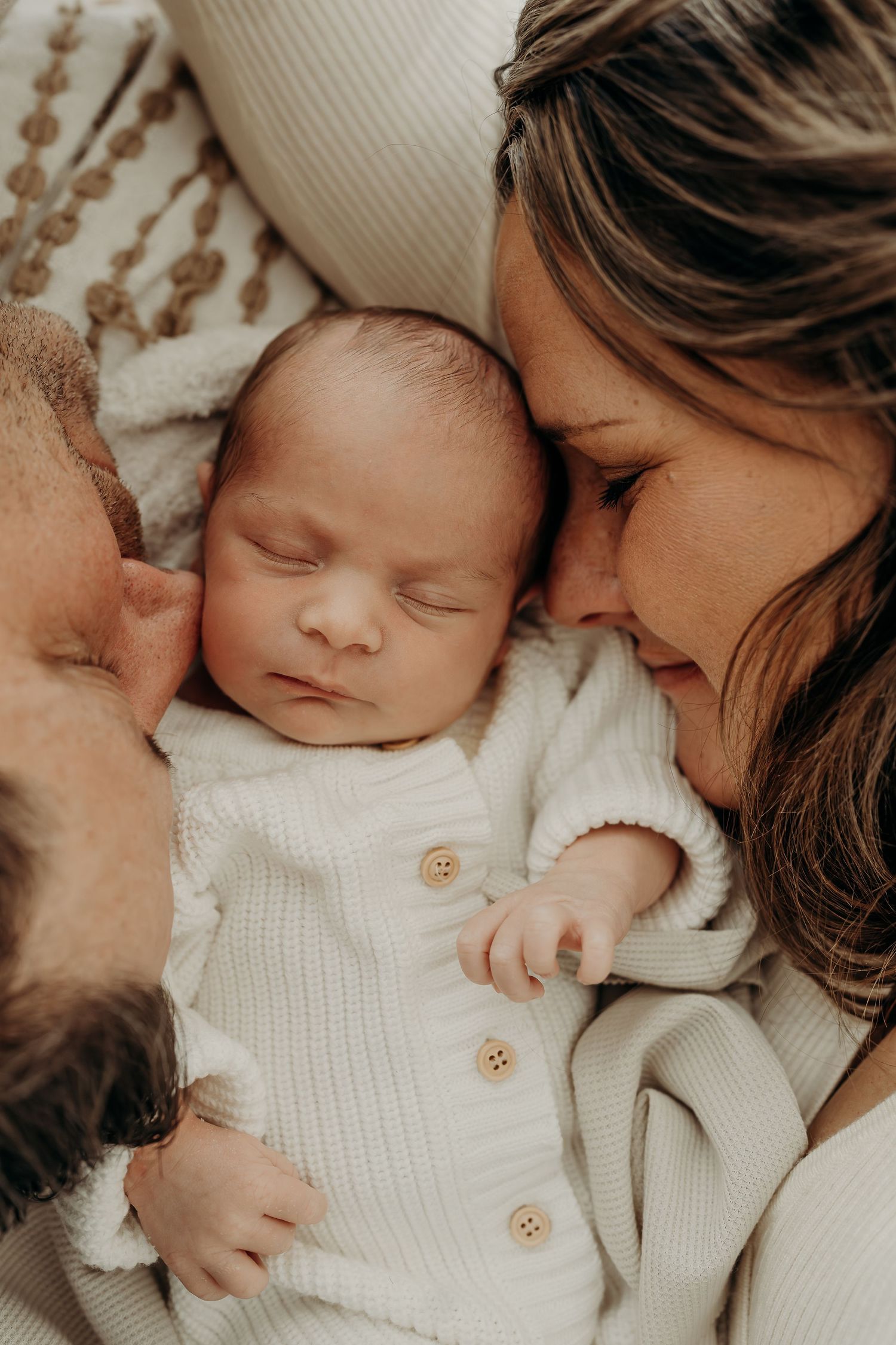 Parents holding newborn baby at Slate Studio in East Troy, WI