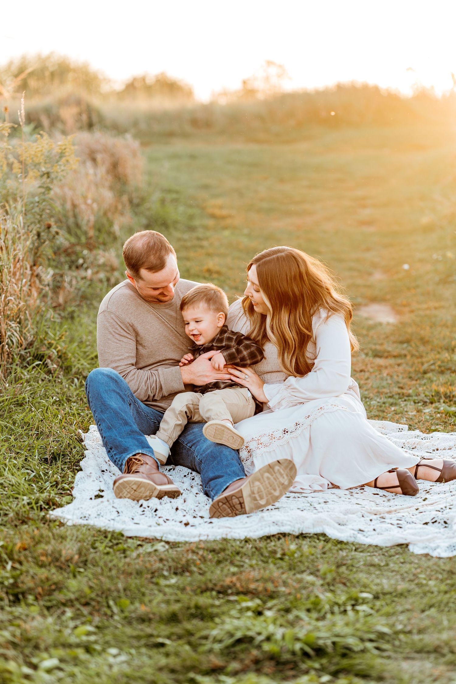 family photoshoot in Lake Country WI during golden hour in open field