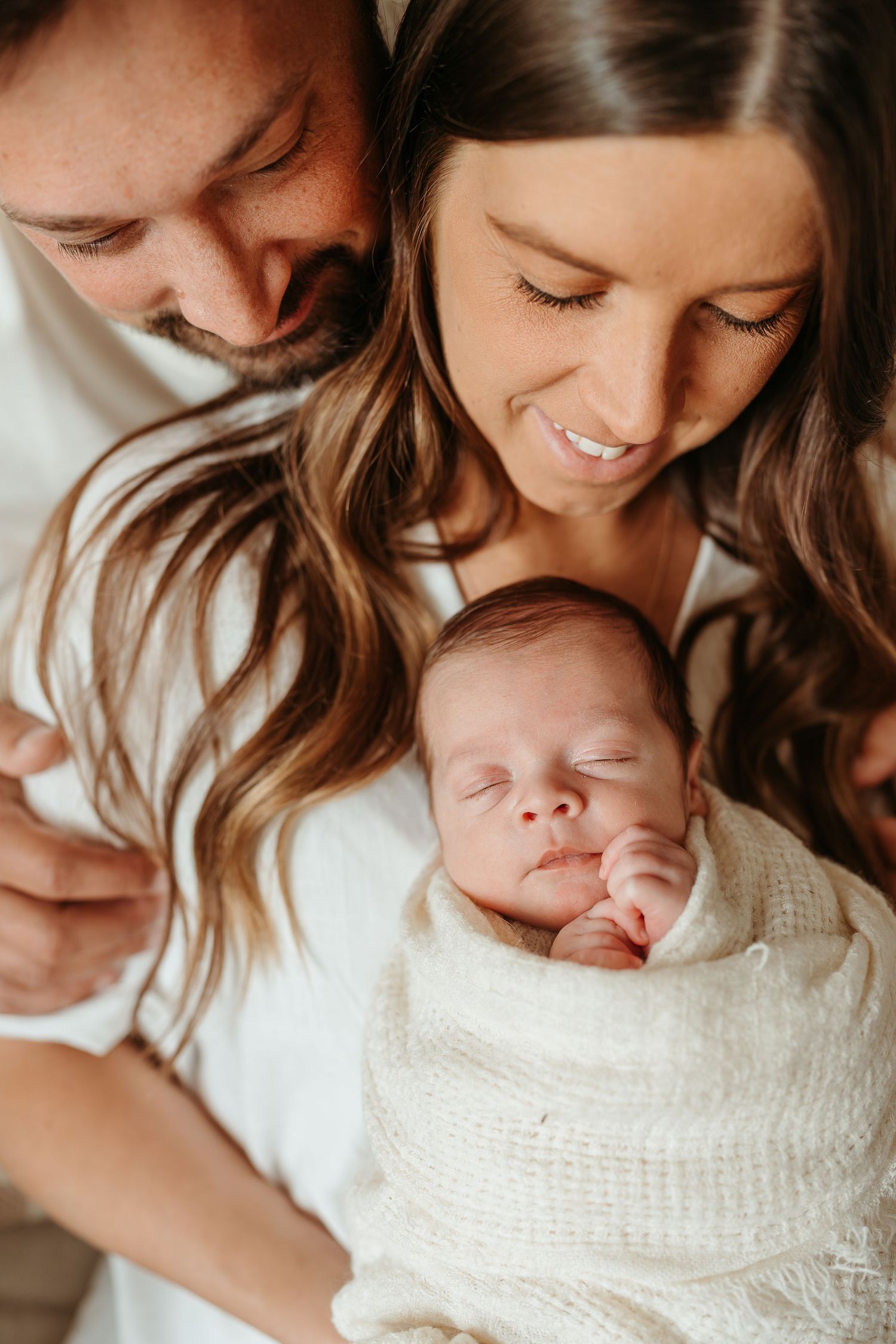 Parents holding newborn baby at Slate Studio in East Troy, WI