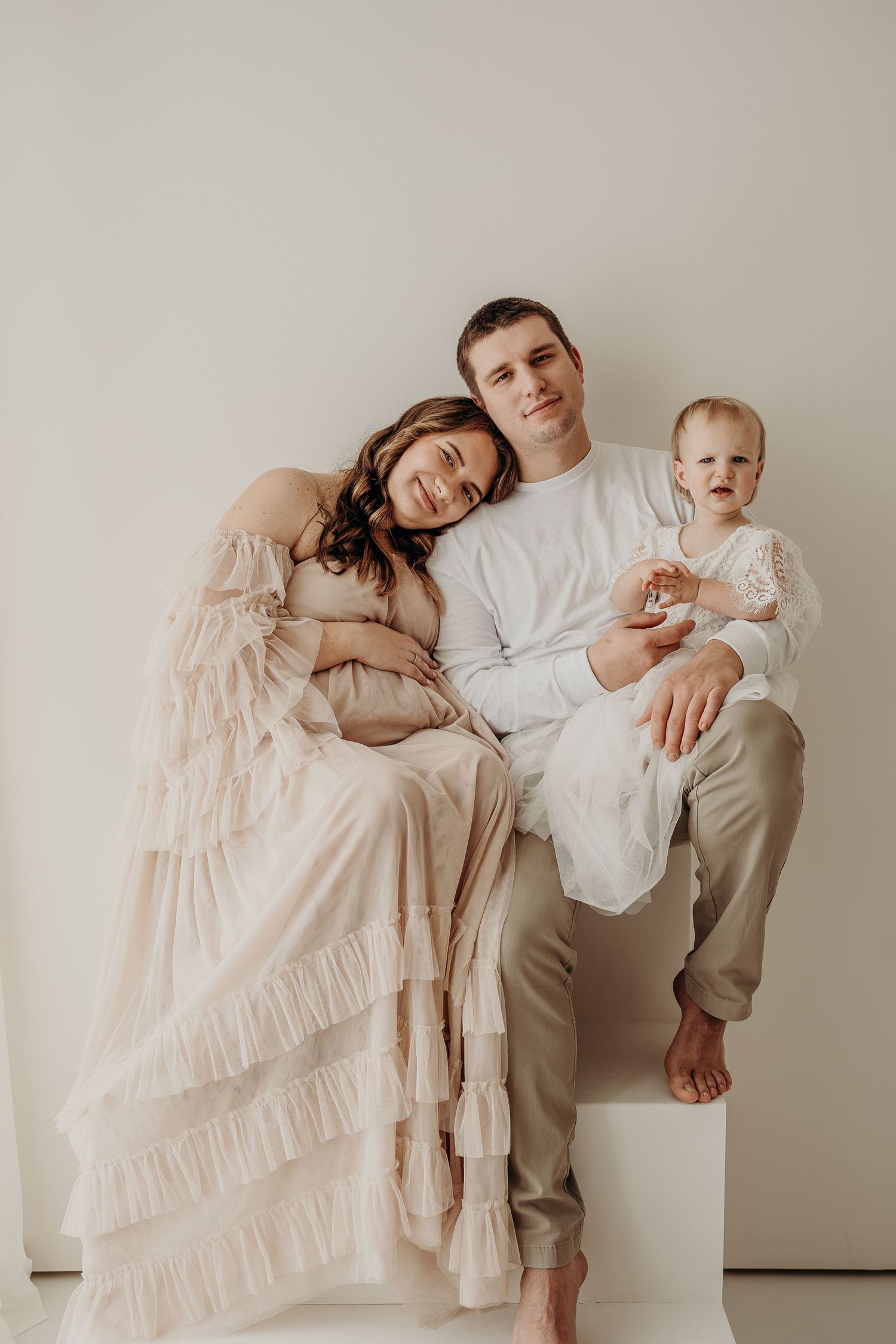 a east troy wisconsin family at a maternity session with a little girl and pregant mom