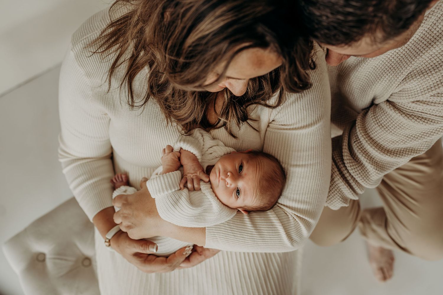 Parents holding newborn baby at Slate Studio in East Troy, WI