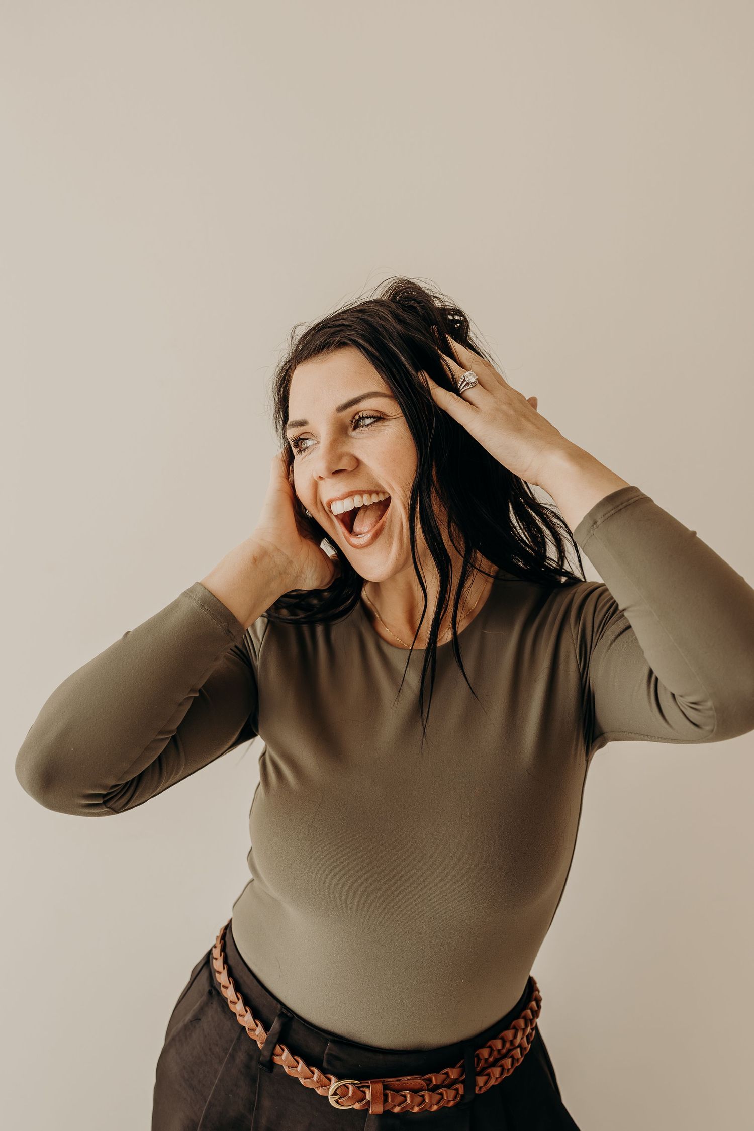 Wisconsin hair and makeup artist laughing during personal branding session