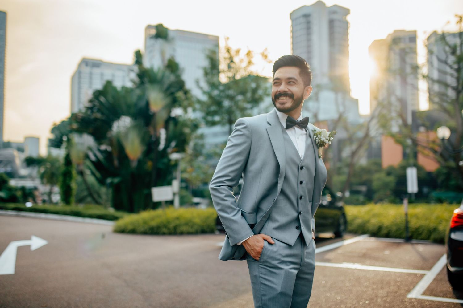 Groom portrait outdoors with city background, modern wedding Singapore