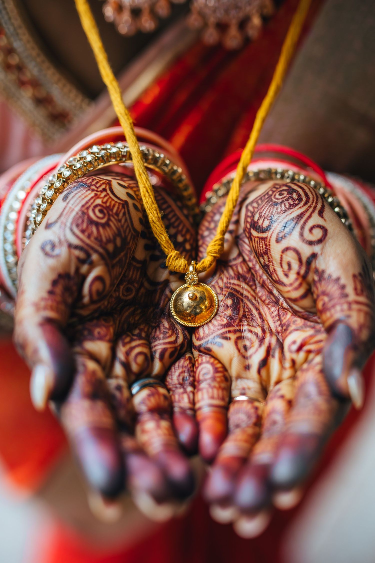 Bride hands holding wedding chain also know as thali , detailed ritual moment