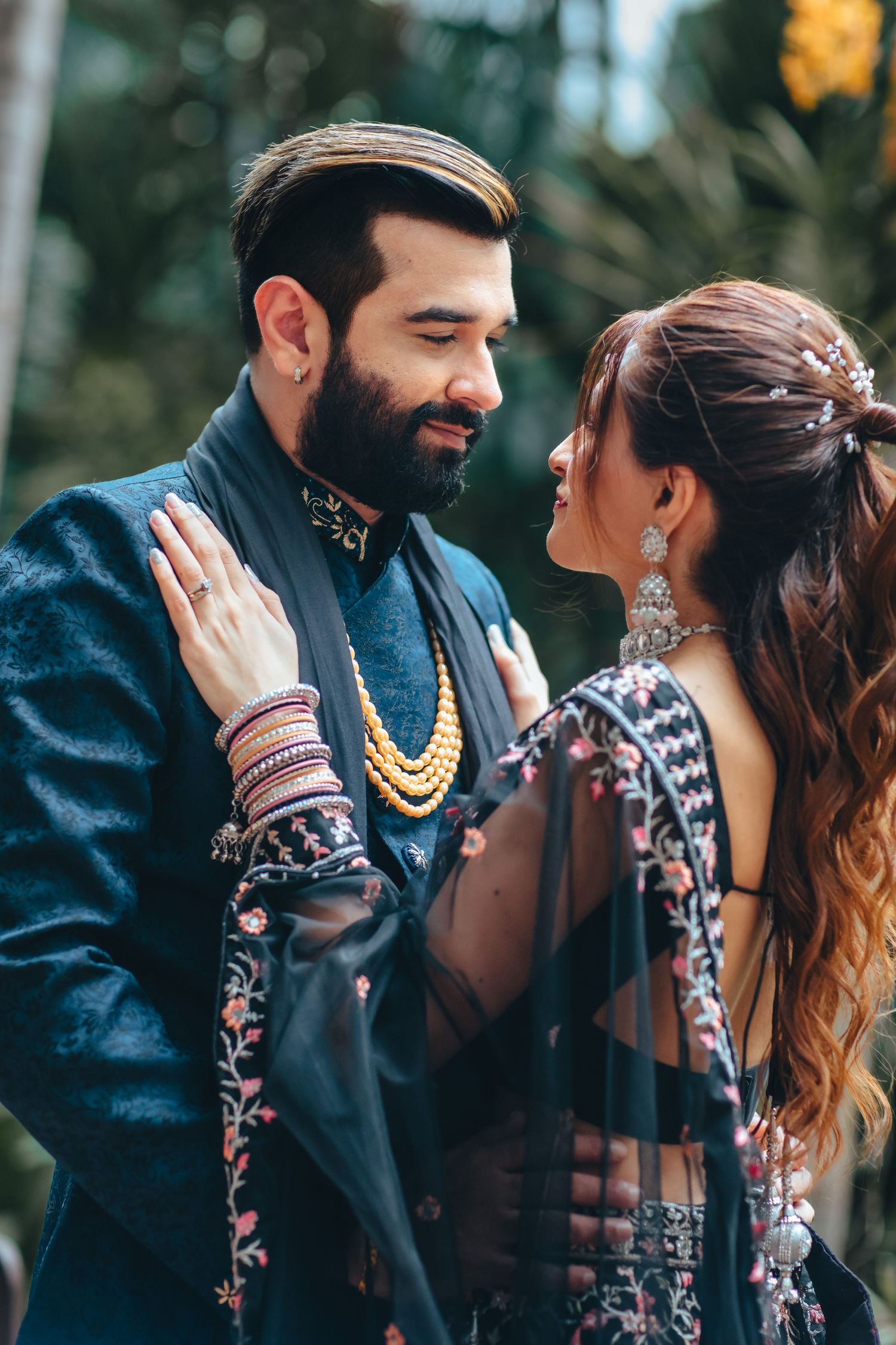 Couple dancing during sangeet night, lively wedding celebration