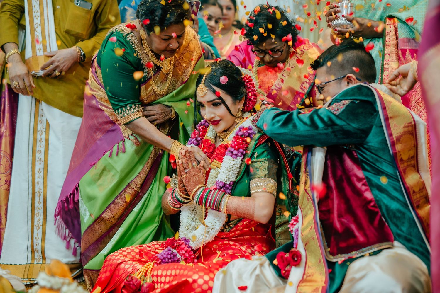 Hindu wedding ritual with family blessings and flowers during the thali tying ceremony Singapore