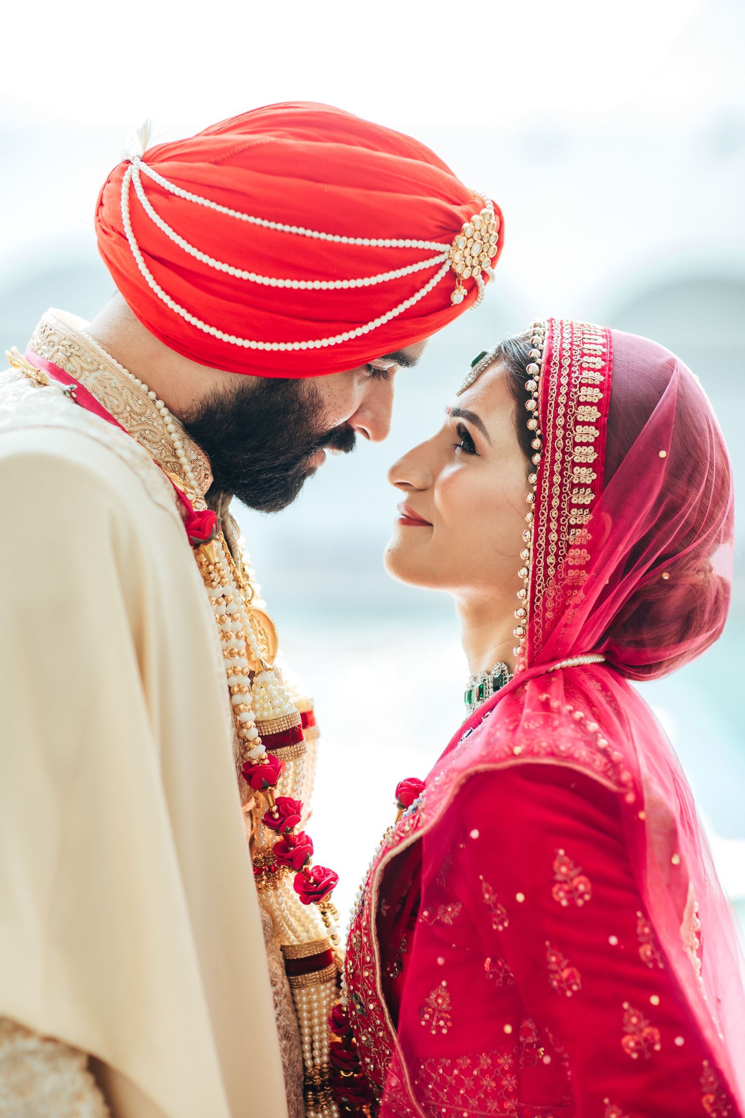 Sikh wedding couple portrait in traditional attire, cultural ceremony editorial style