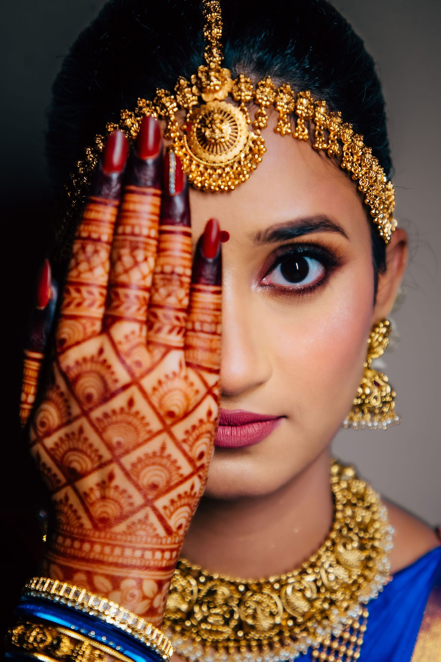 Bridal close-up with jewellery and mehendi, detailed portrait