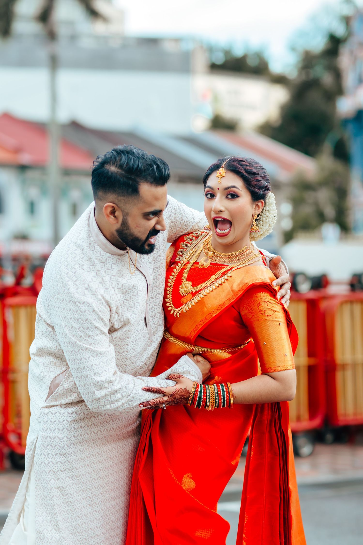 Fun Couple in traditional attire during ceremony, Indian wedding Singapore