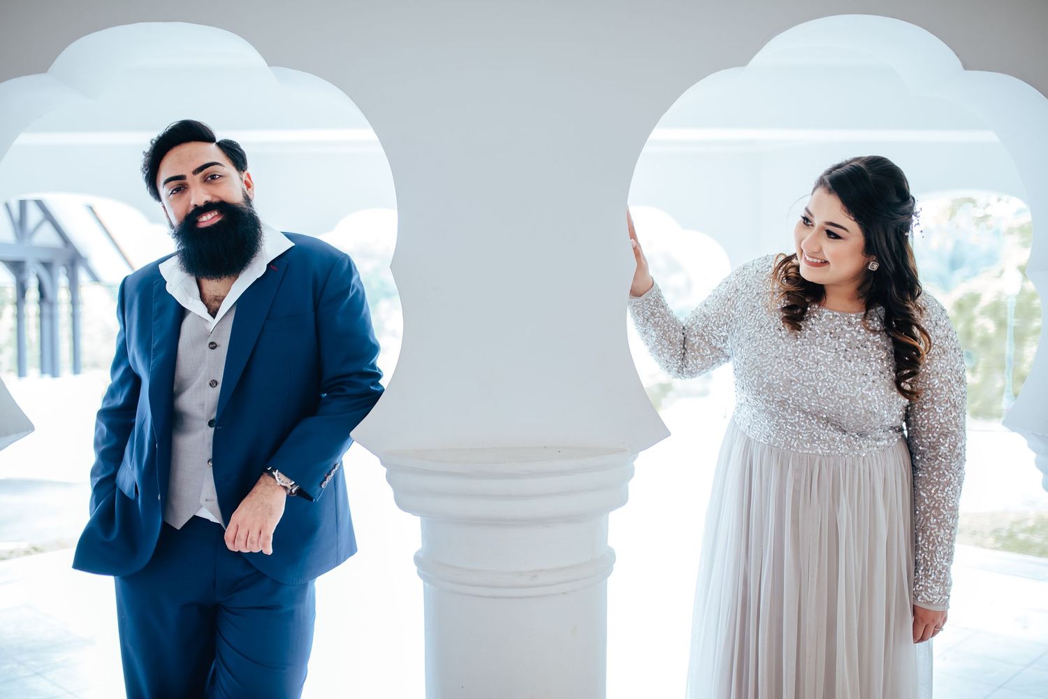 Couple posing in modern architecture with clean aesthetic, editorial photography