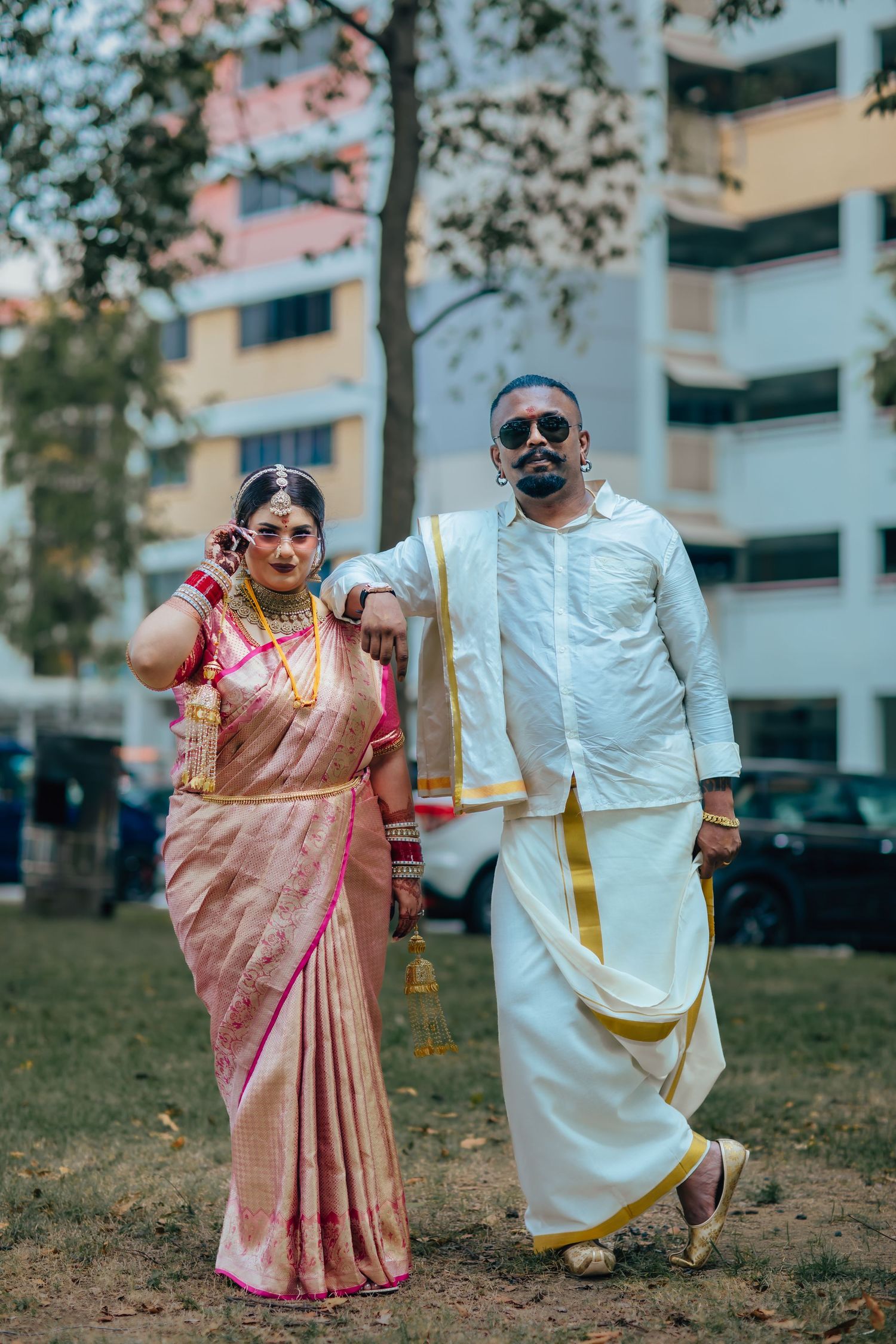 Couple portrait in traditional attire outdoors, cultural wedding photography Singapore