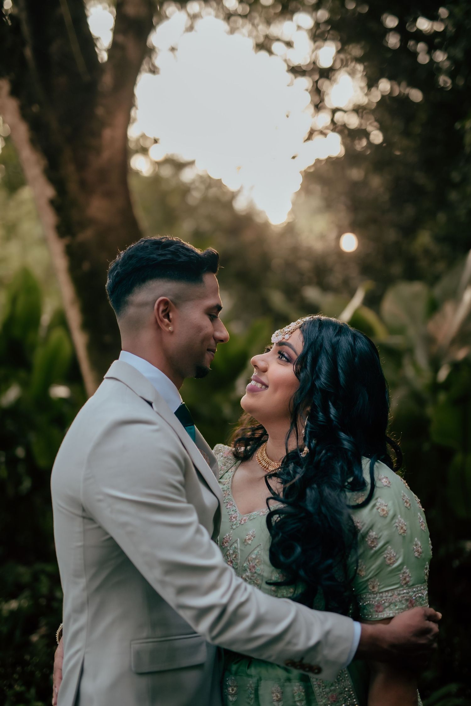 Outdoor couple portrait with soft sunlight and greenery, romantic pre wedding Singapore
