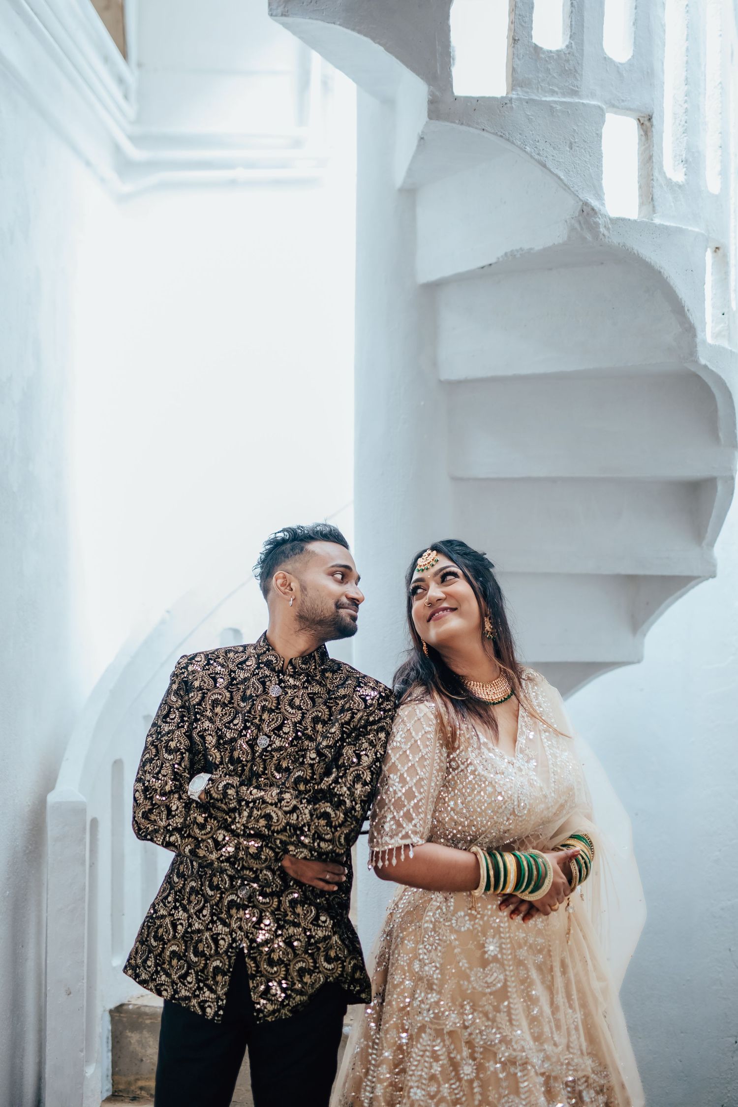 Couple portrait on modern staircase with soft tones, editorial pre wedding Singapore