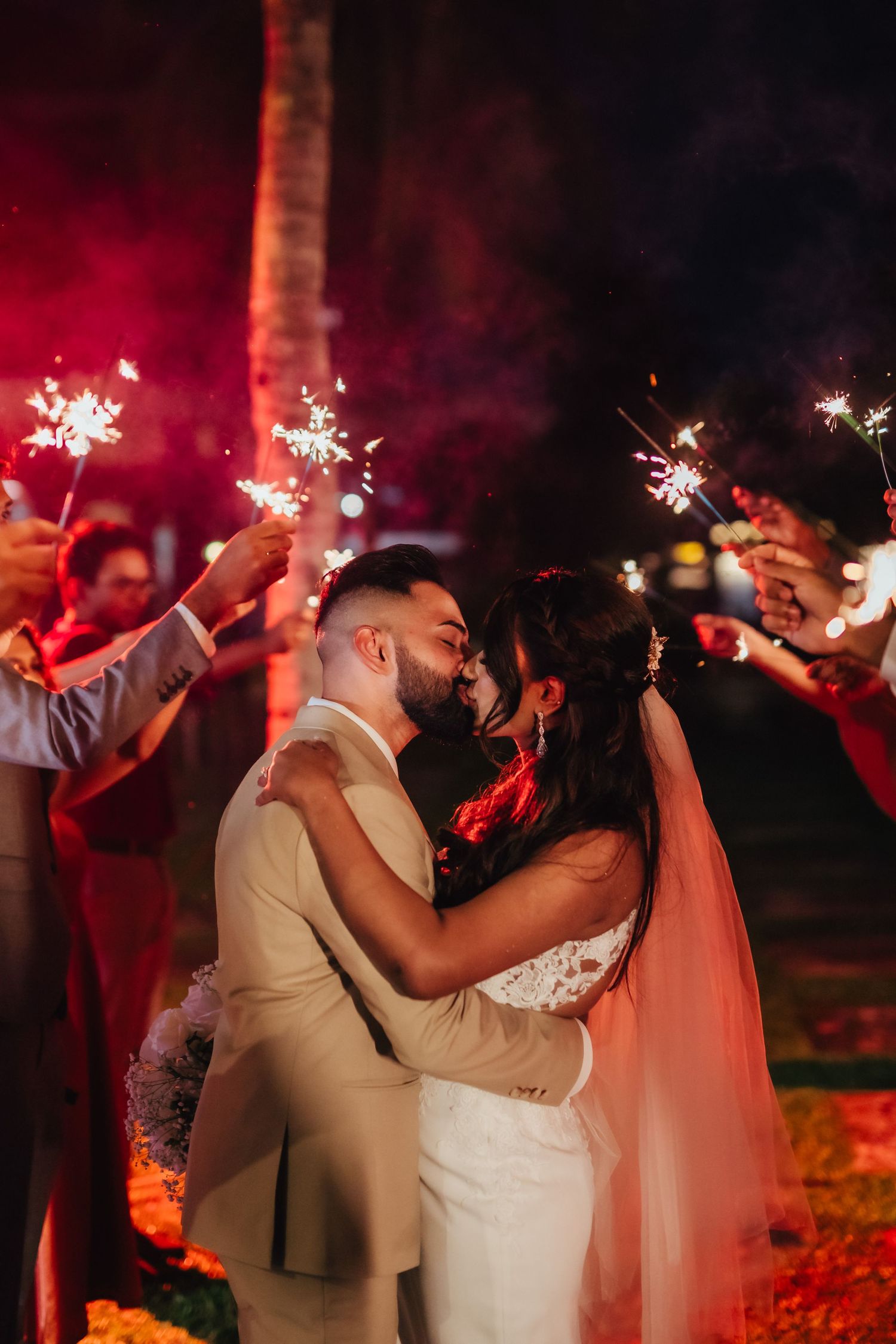 Wedding ROM celebration couple entrance with sparklers, candid joyful moment, modern wedding photography Singapore