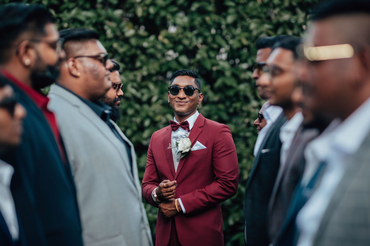 Groom portrait with groomsmen, candid wedding moment Singapore