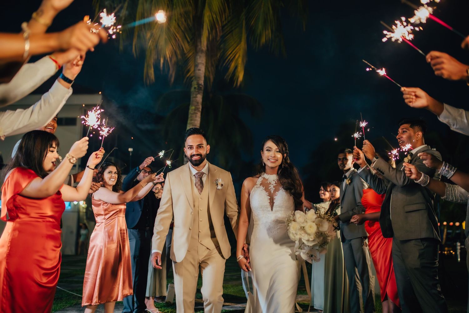 Wedding ROM celebration couple entrance with sparklers, candid joyful moment, modern wedding photography Singapore