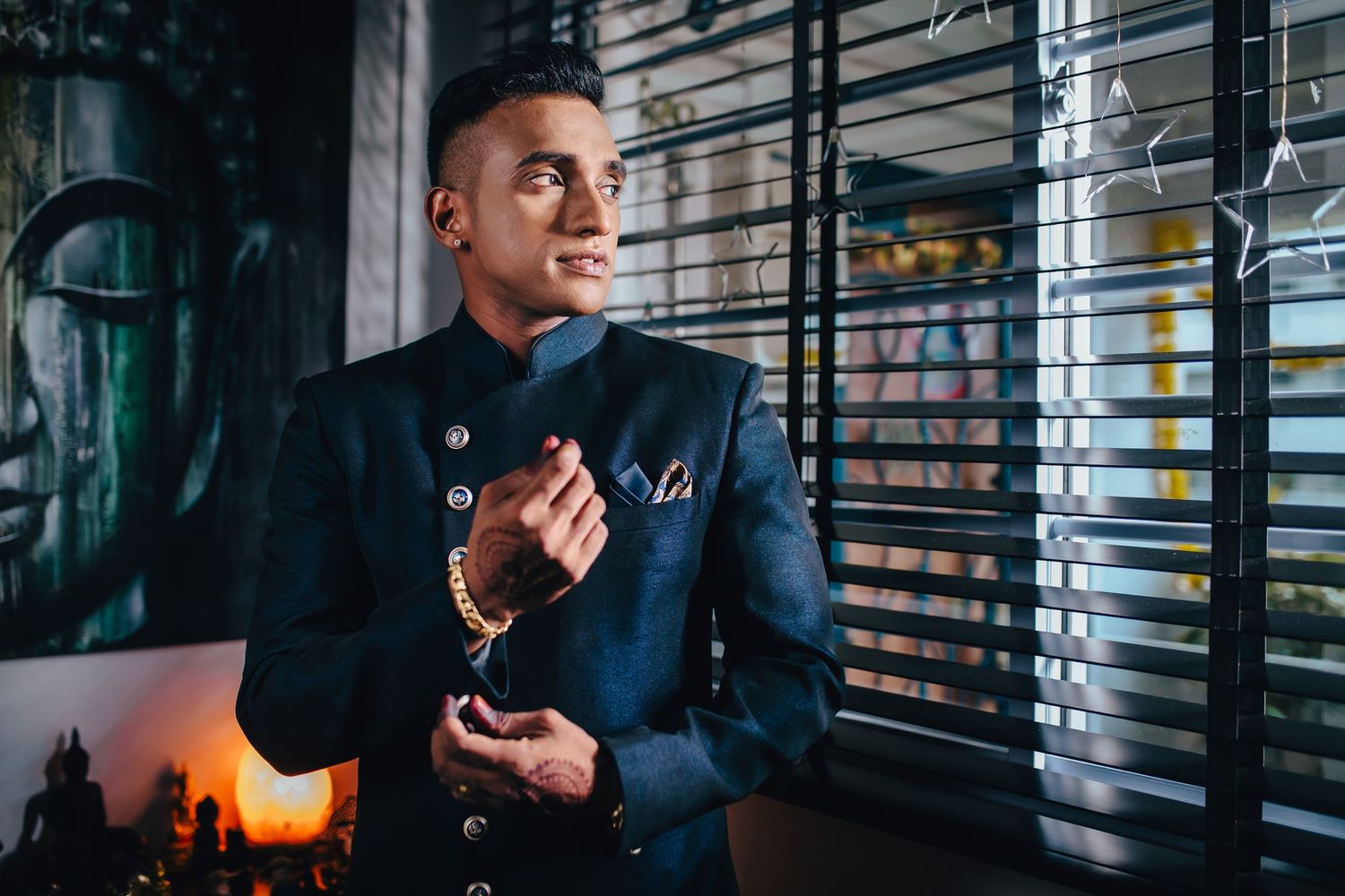 Groom portrait near window light, elegant wedding preparation