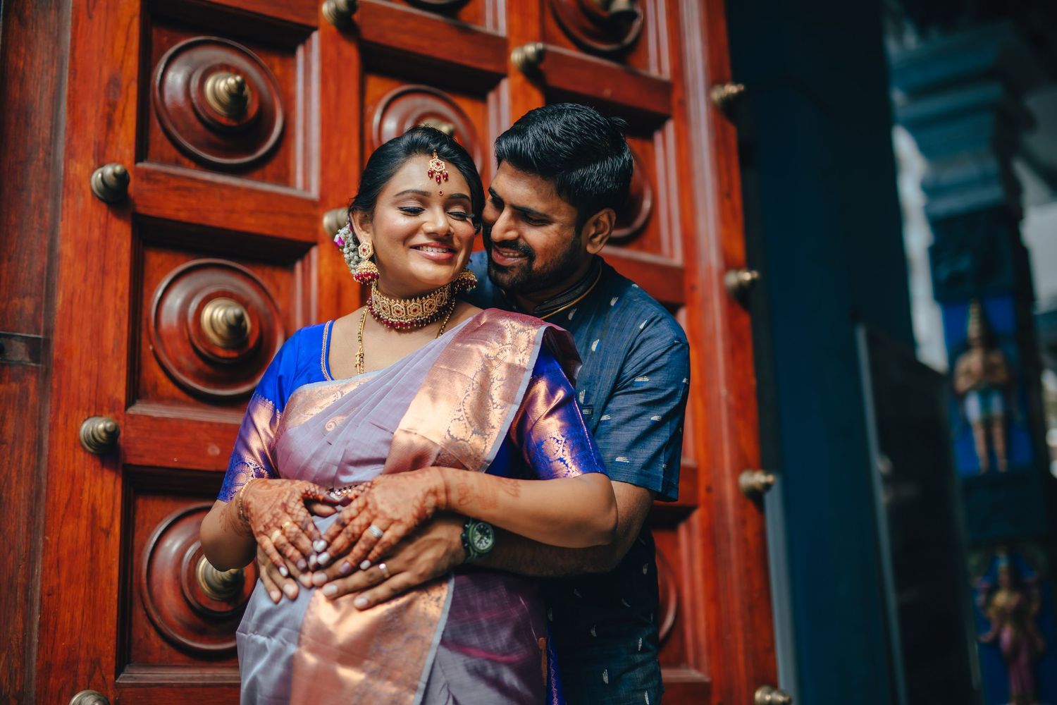 Couple celebrating baby shower with joyful expressions, maternity event Singapore