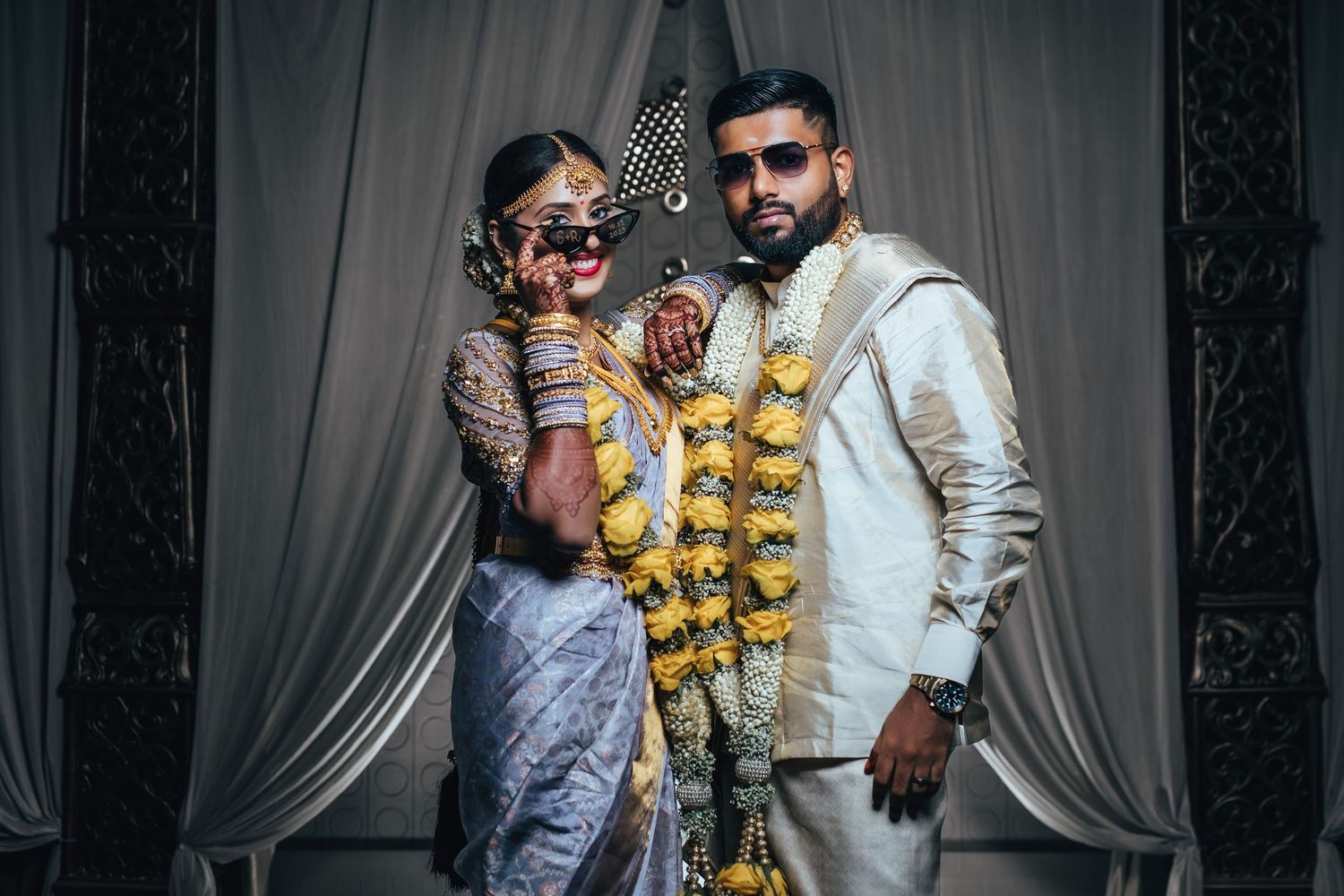 South Indian temple wedding couple in traditional attire with garlands, elegant portrait, wedding photography Singapore