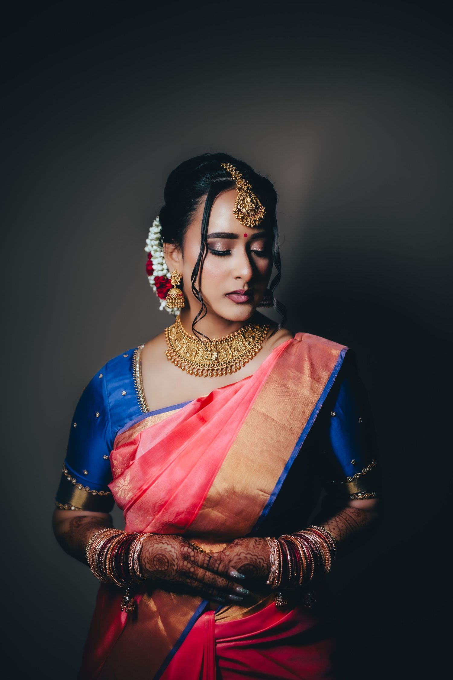 Bride portrait in saree with soft lighting, traditional elegance