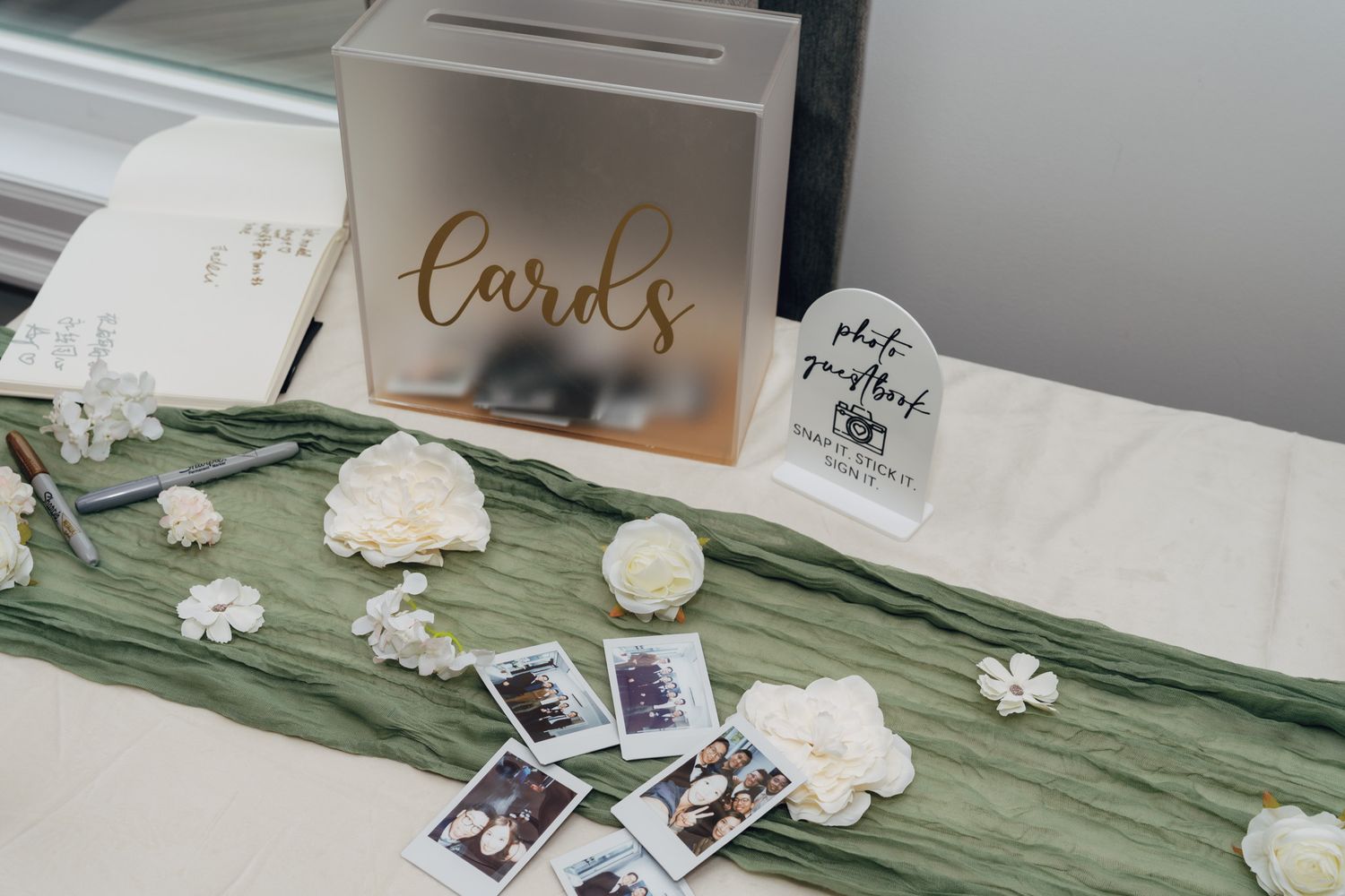 Wedding card box with Instax photos, white florals, guest book, and greenery runner at a Razi Estate forest wedding, Schomberg, ON