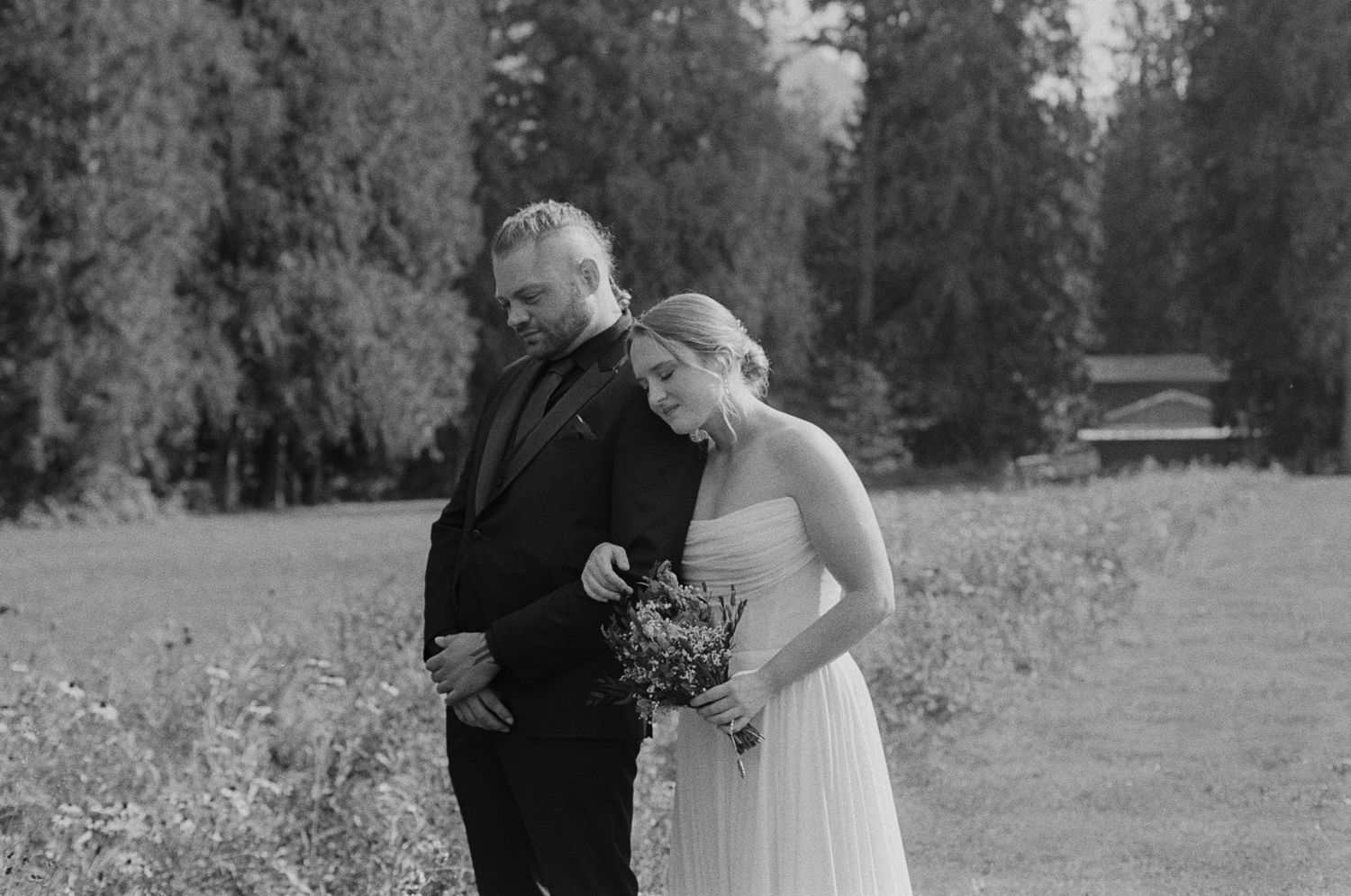Black and white bride and groom portrait among trees at Bridlewoods Event Center in Chilliwack for Vancouver wedding photography