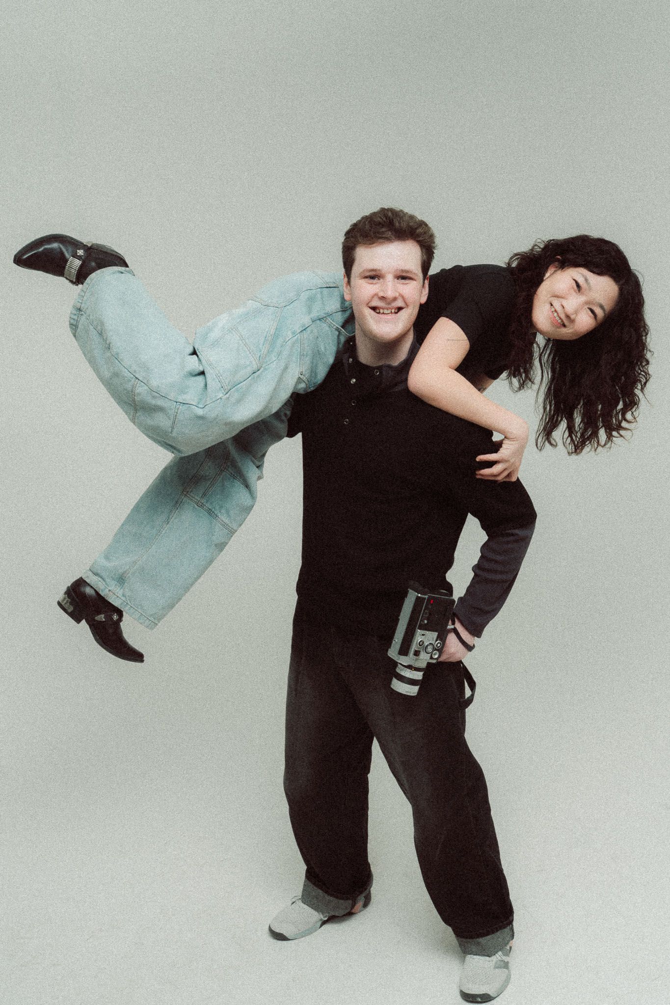 ILO Studio founders Bradley and Clarise laughing with a camera during their studio branding day portrait session
