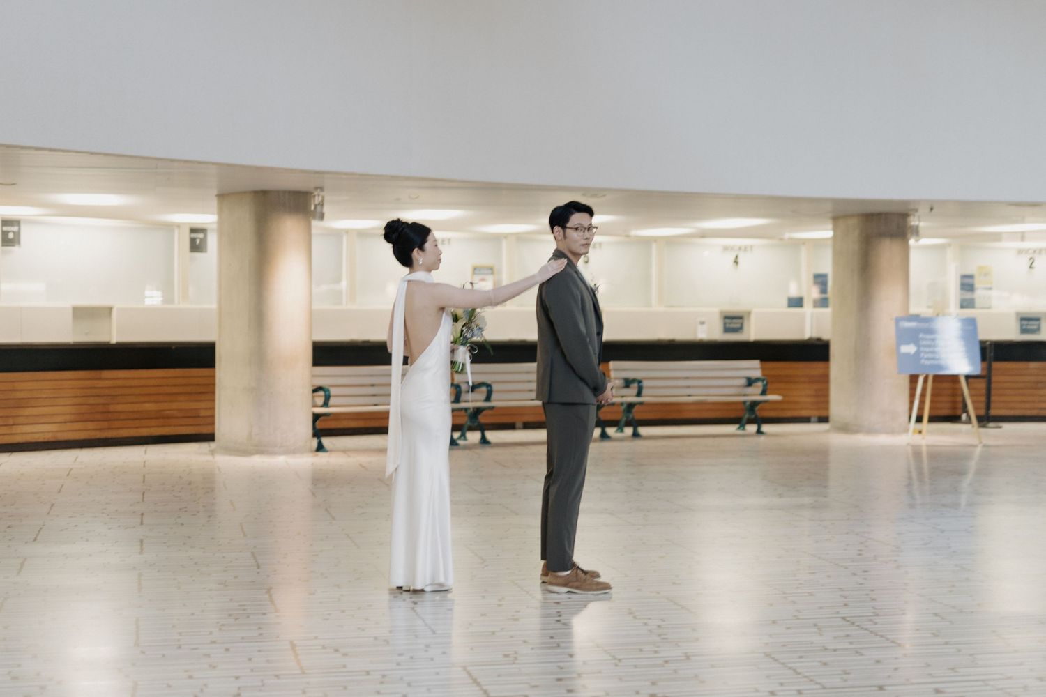 Bride and groom dancing during a candid first look at Osgoode Hall for Toronto City Hall wedding photography.