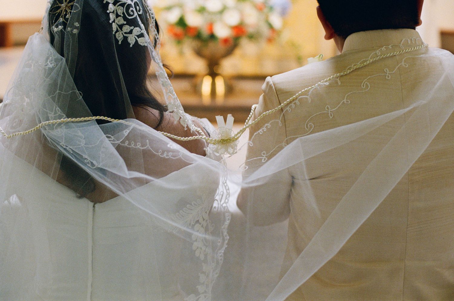 Bride and groom standing at the altar during their Catholic ceremony at St. Joseph’s Parish in Langley for Vancouver wedding photography