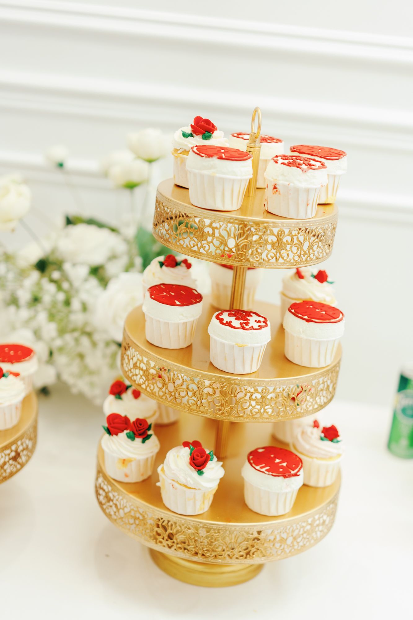 Gold cupcake stand with frosted cupcakes, red roses, and double happiness symbols at Bellamy Loft in North York, Toronto.