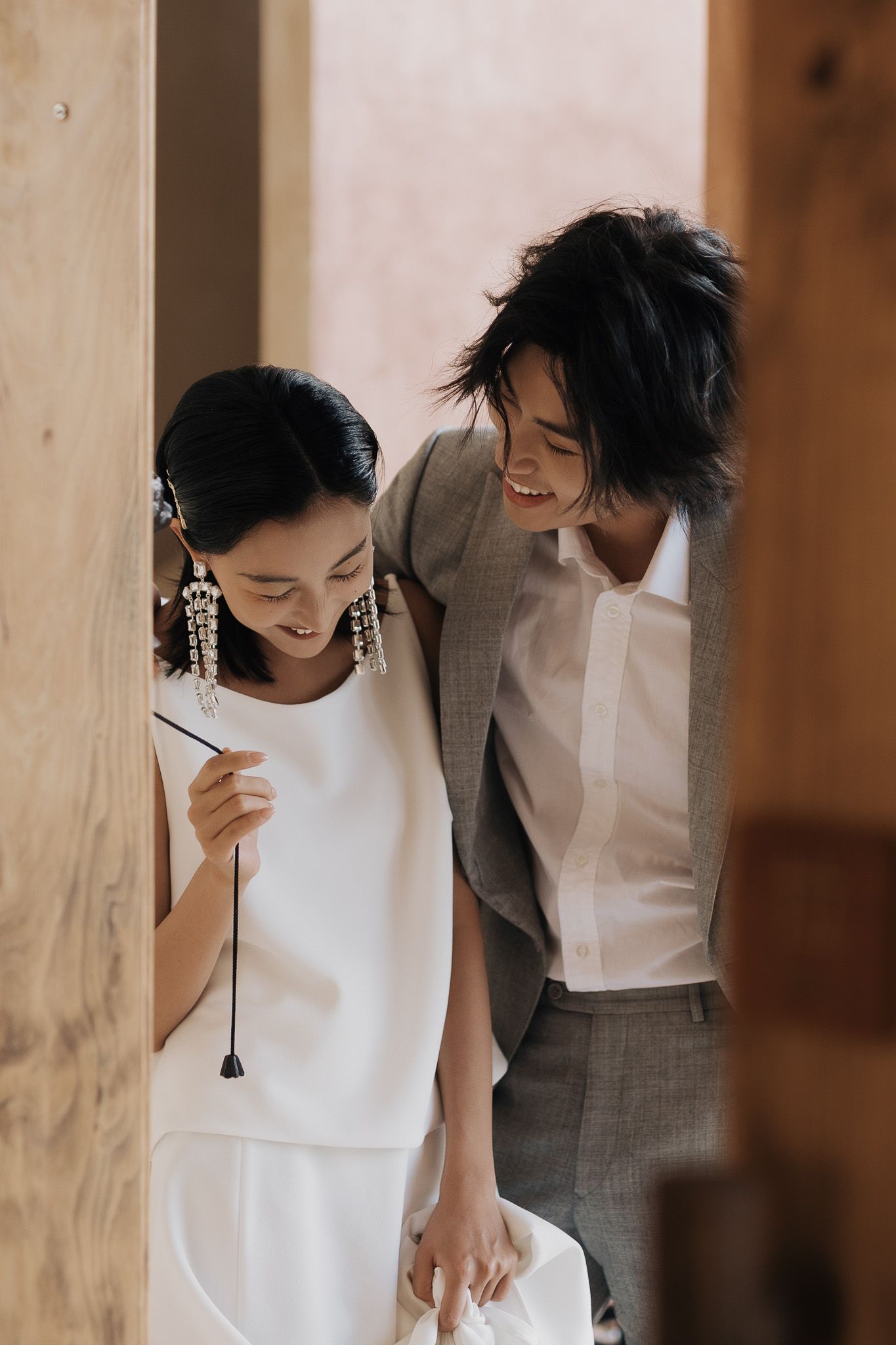 Bride and groom sharing a joyful candid moment before their Toronto wedding for editorial wedding photography