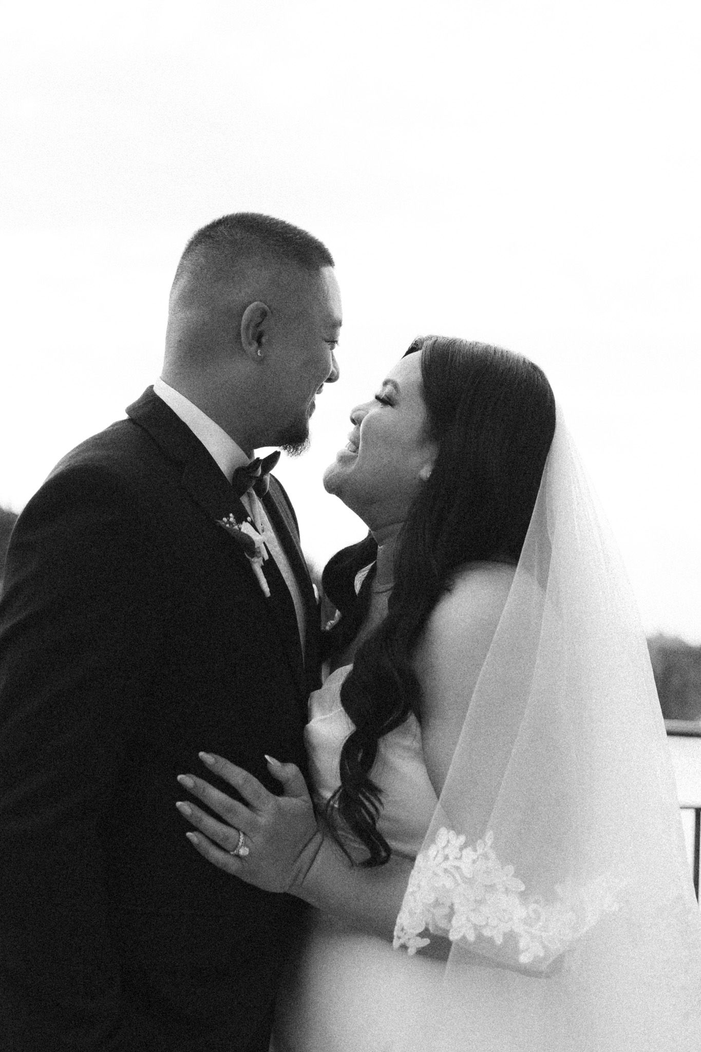 Black and white bride and groom sharing a romantic moment at Cambridge Mill in Cambridge, Ontario for timeless wedding photography.