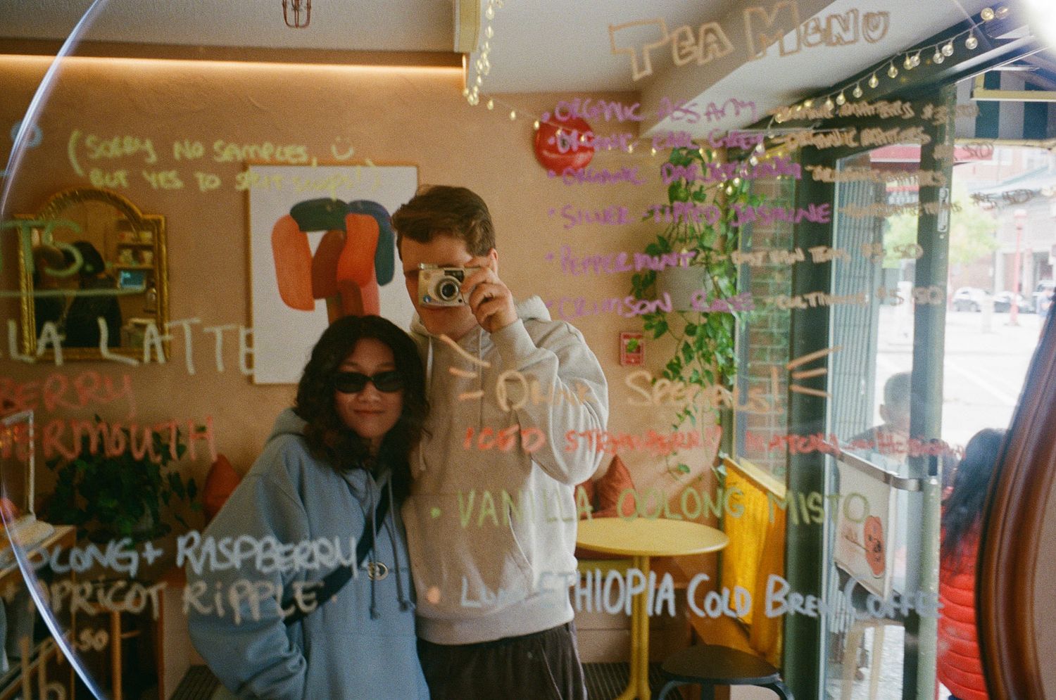 ILO Studio founders Bradley and Clarise taking a cozy cafe selfie while enjoying coffee together on their day off