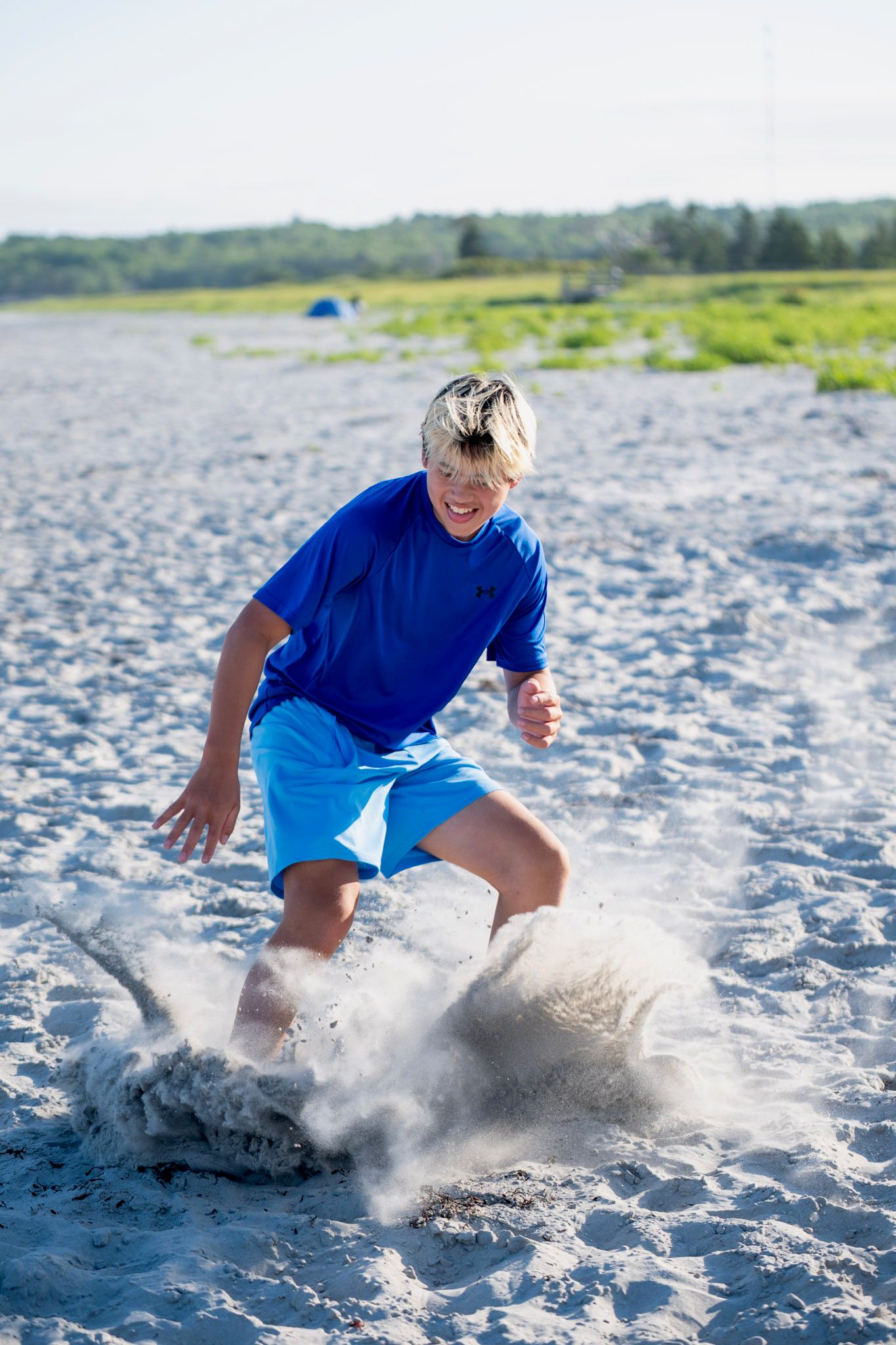 Guy stopping on a beach in Canada slightly after the last picture