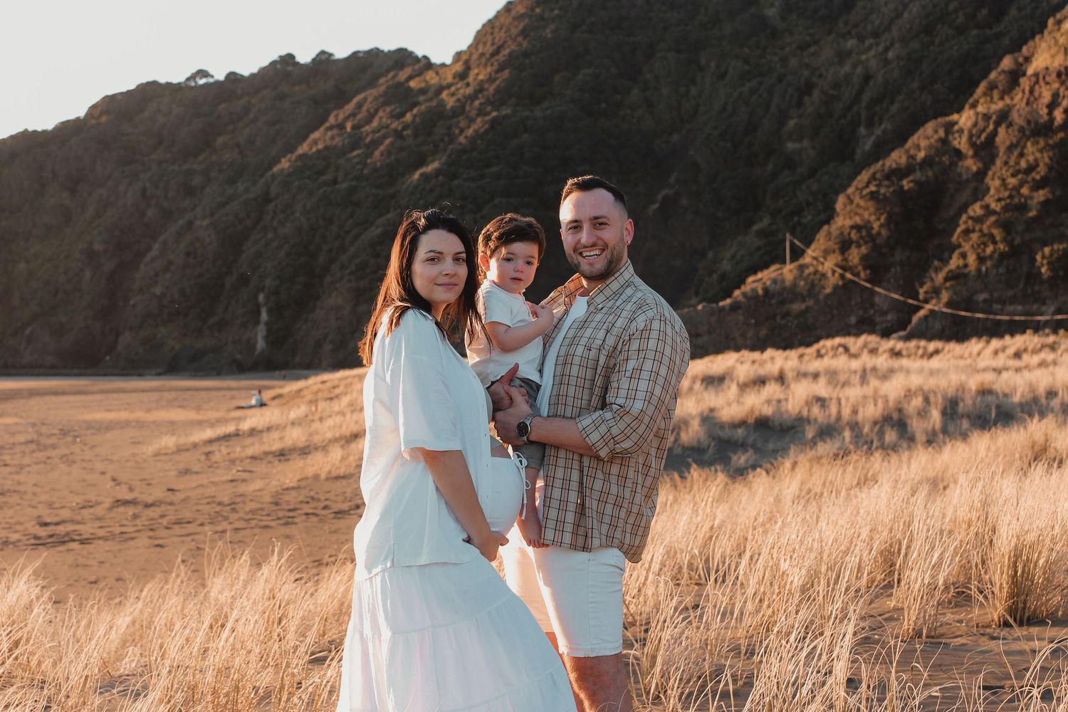Family photographer at Piha Beach. Capturing the natural precious moments.