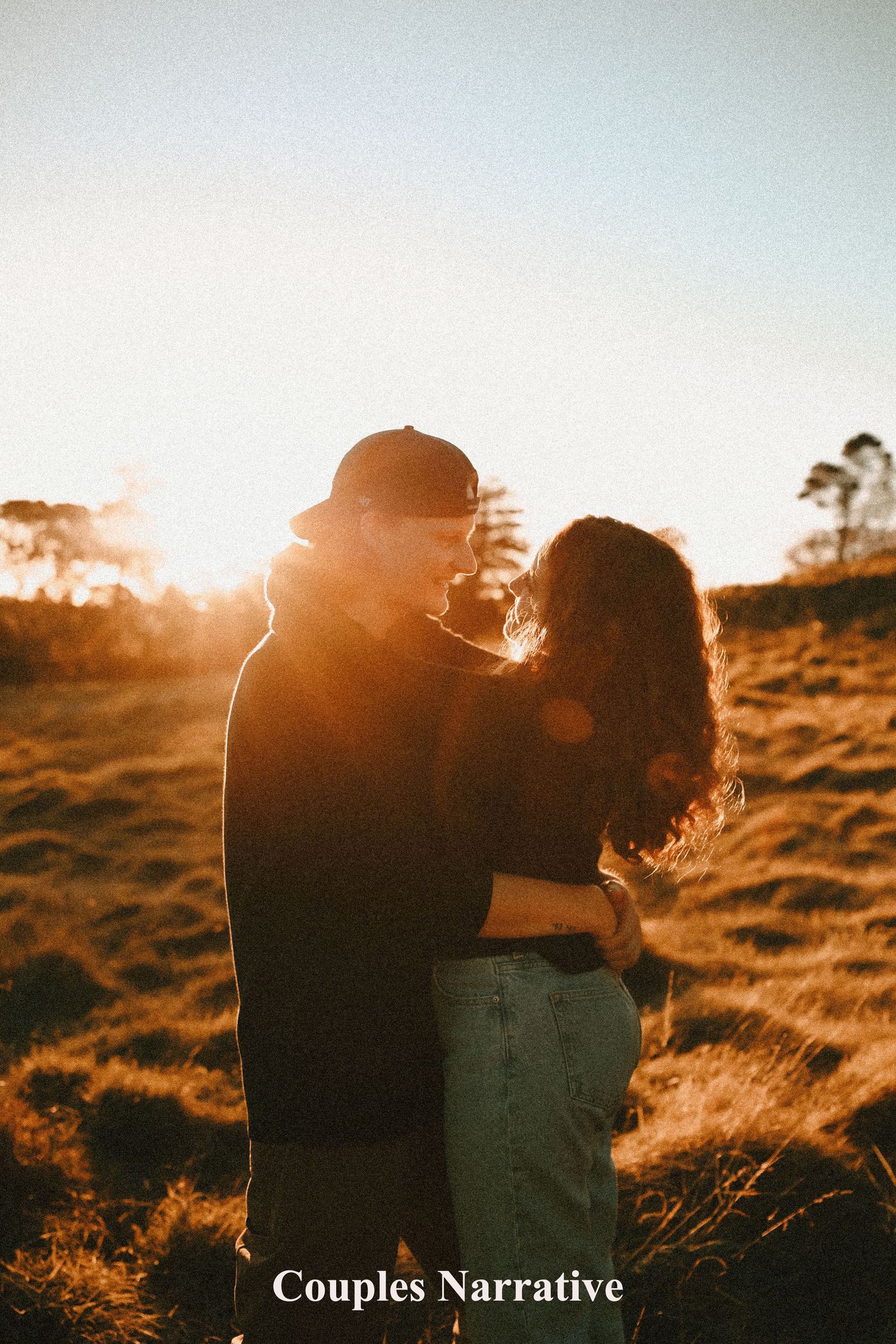 A heartwarming moment of a mother and daughter hugging during a family photography session in Auckland one tree hill, Cornwall park
