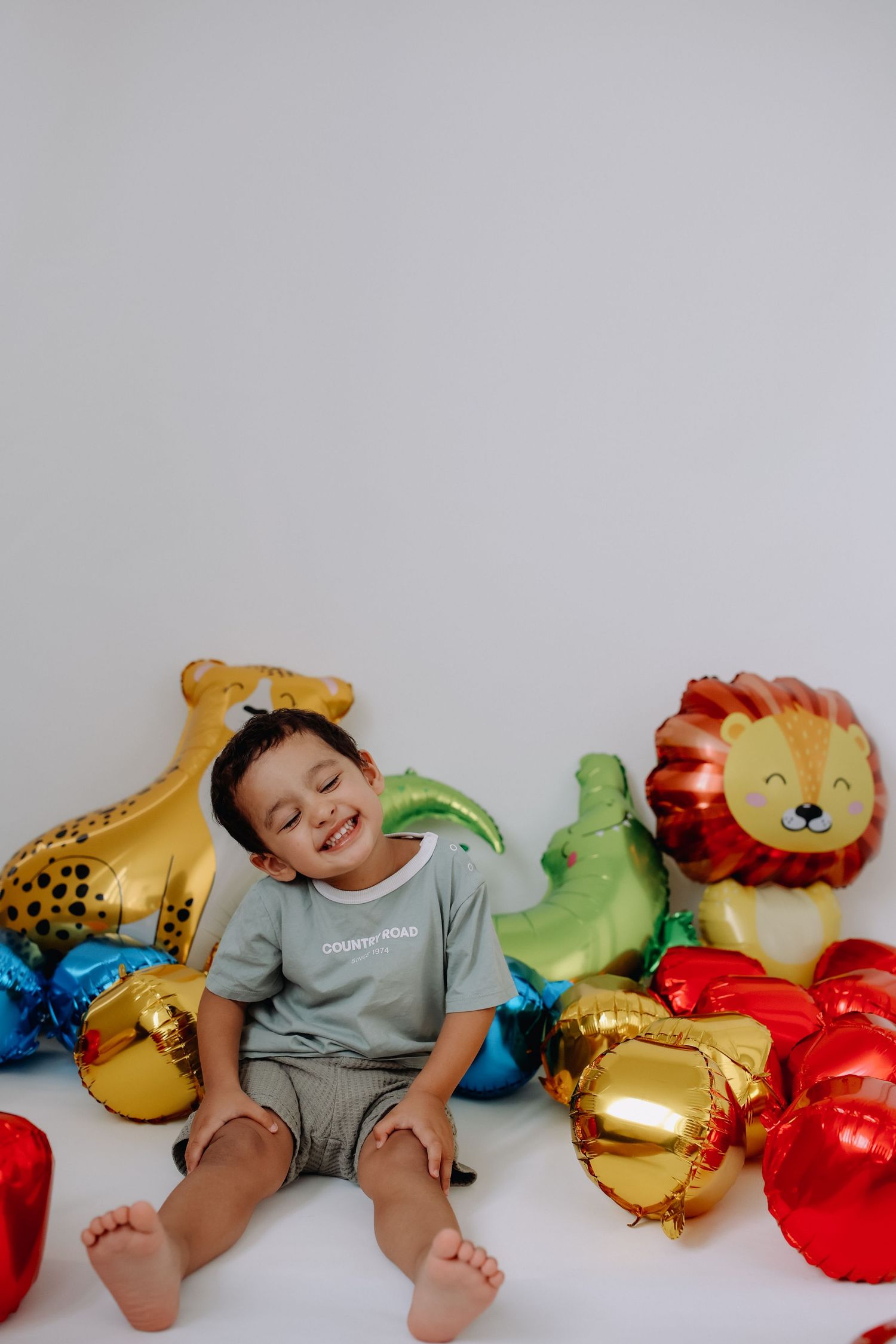 Toddler with toys,  studio photo mini sessions.
