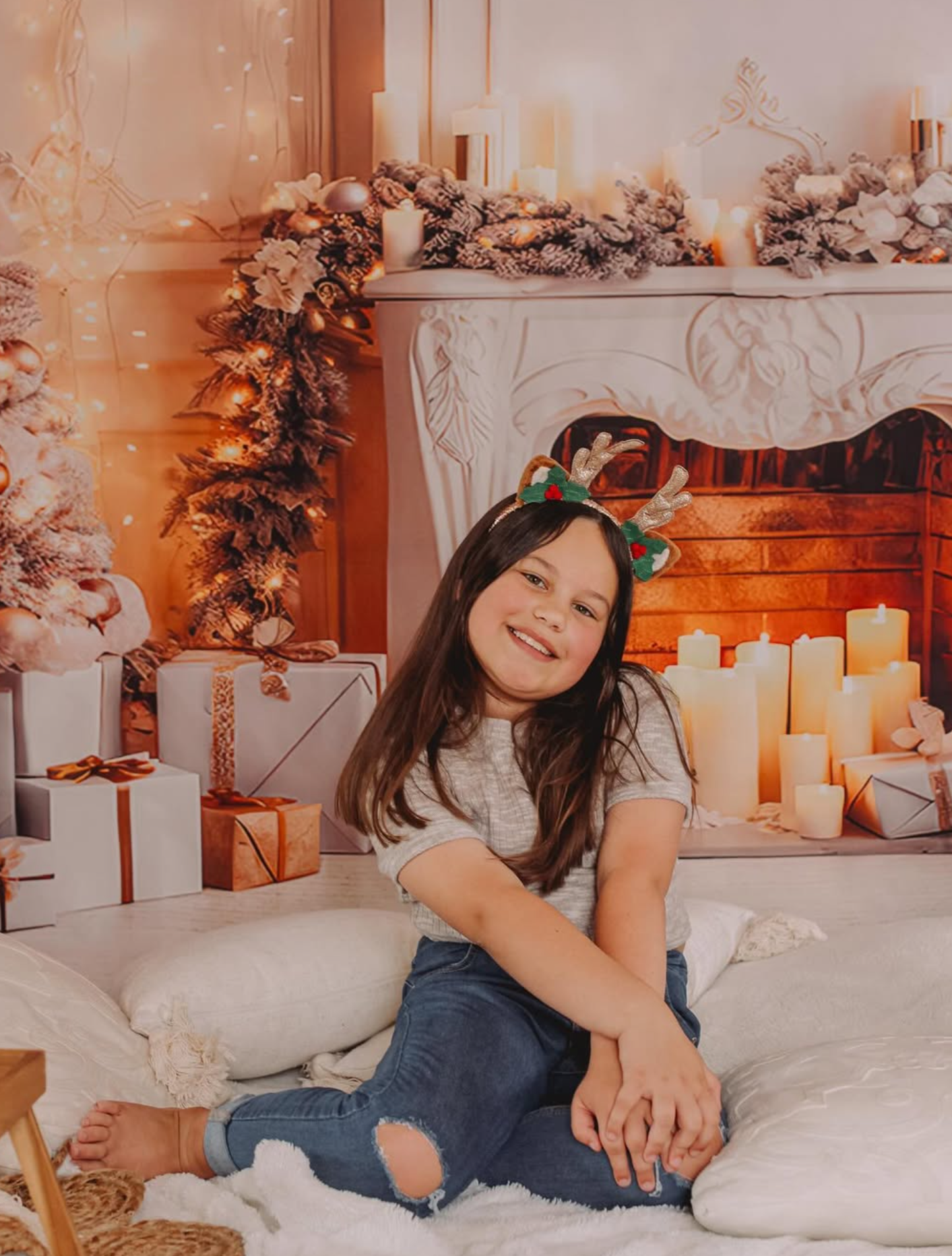 Classic Christmas studio photography featuring red velvet accents and a decorated evergreen tree.