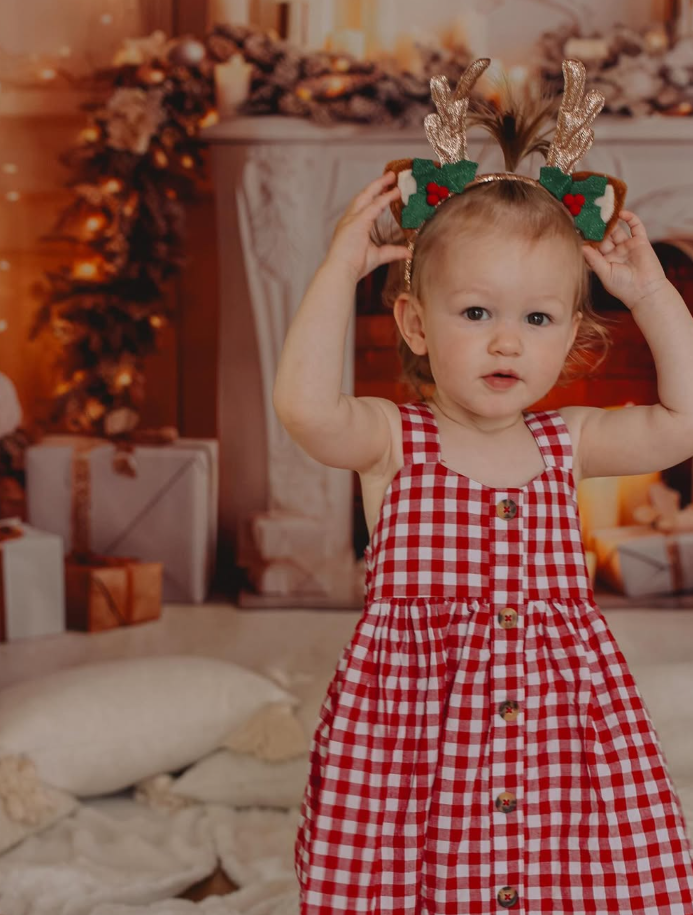Baby’s first Christmas portrait in a professional Auckland studio with festive props.
