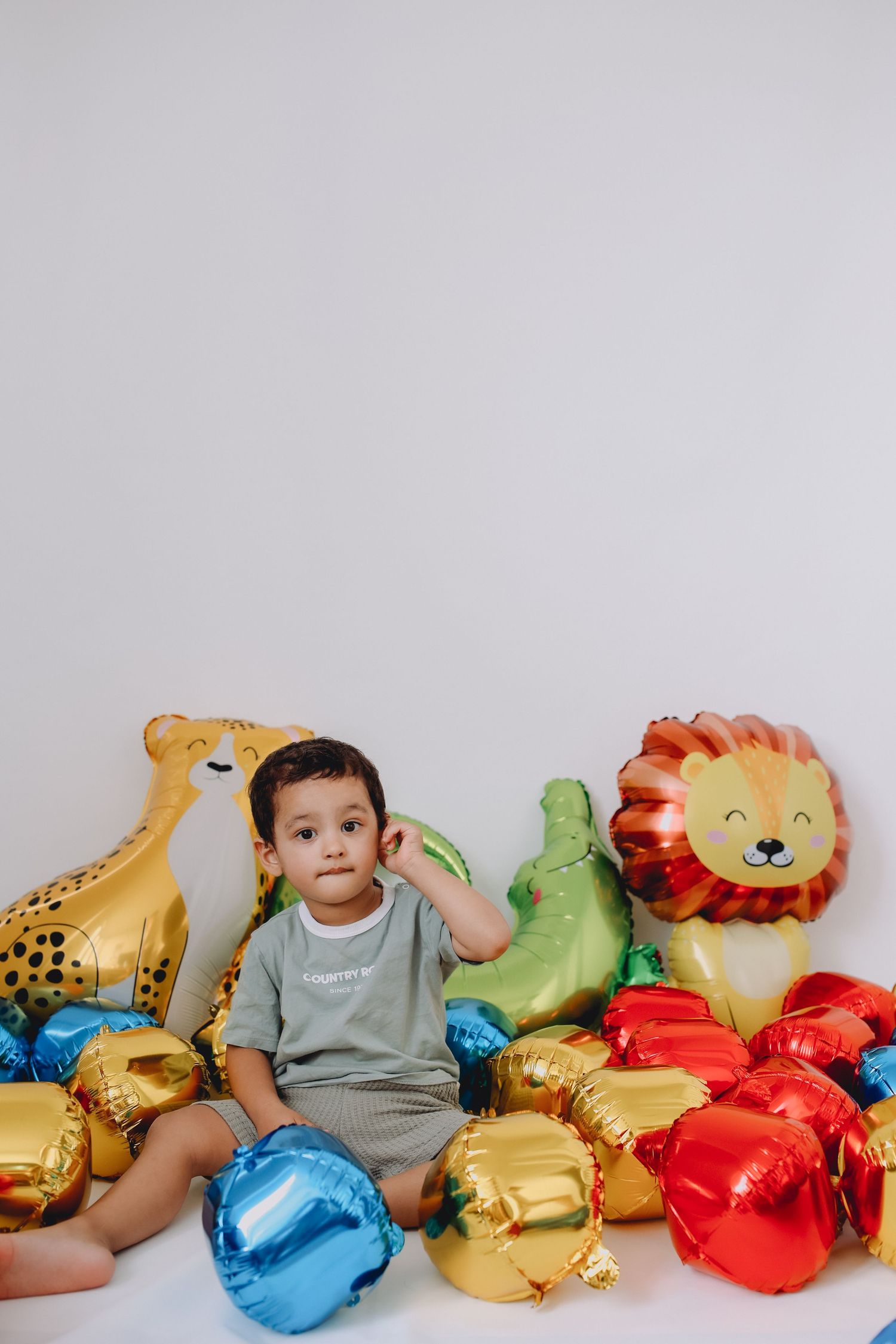 Toddler with favourite toys,  studio photo mini sessions.