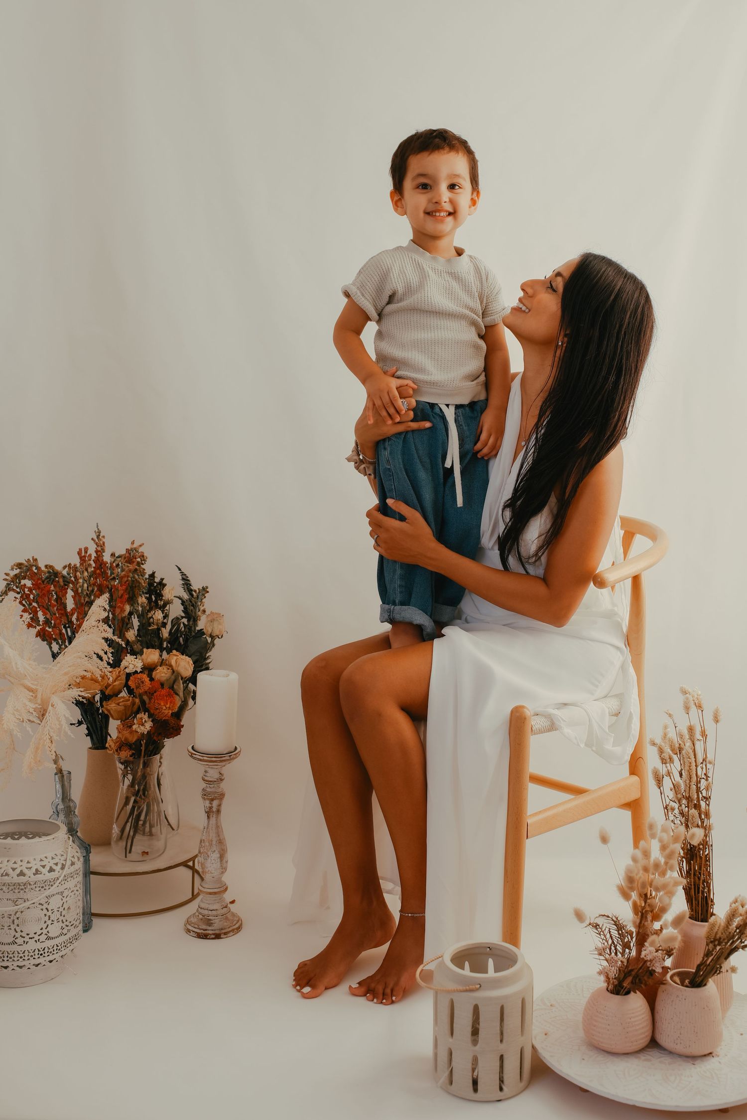 Mother’s Day photoshoot featuring a floral backdrop and soft pastel colors.