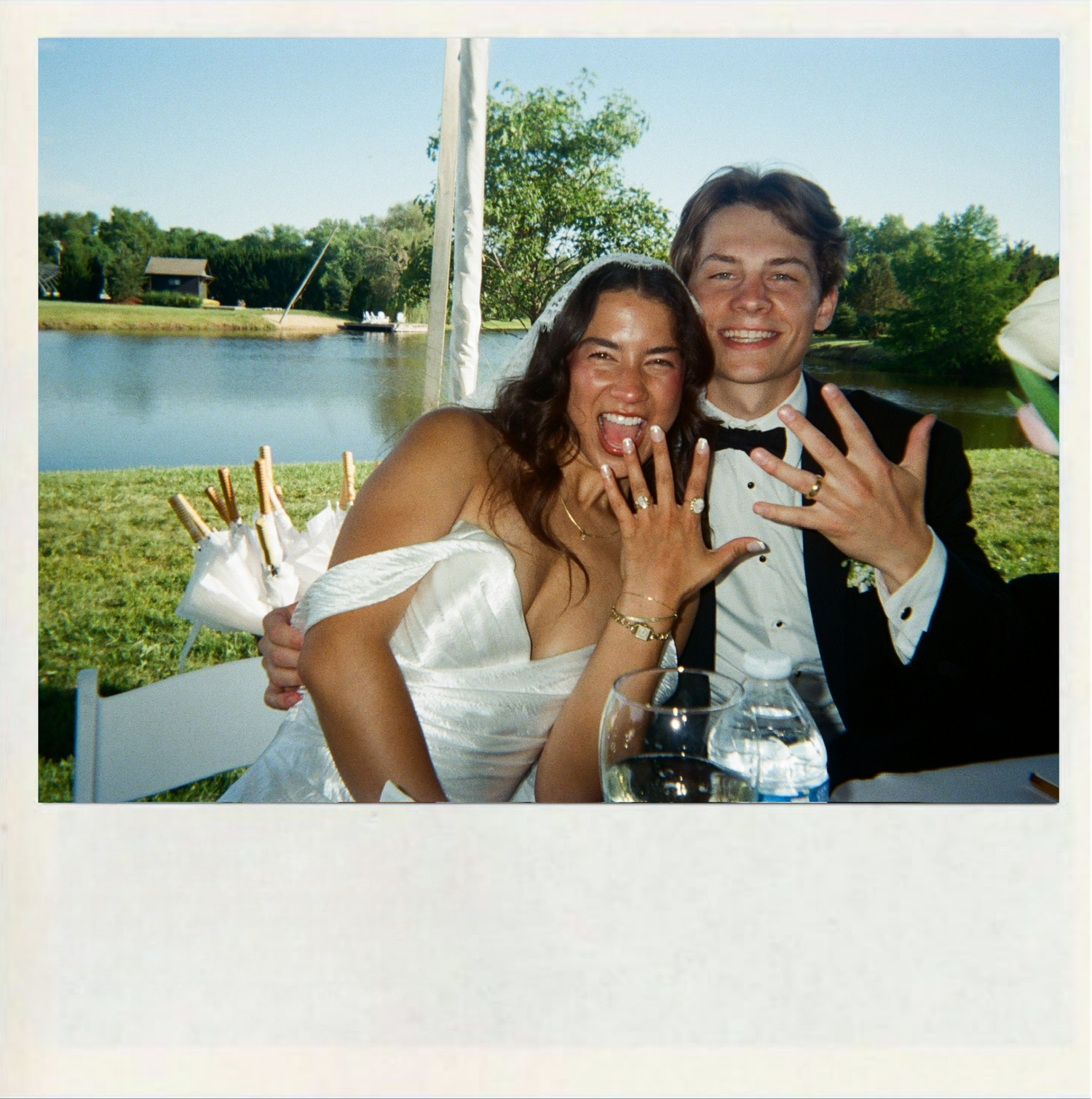 Joyful wedding celebration photos showing couples and friends enjoying outdoor moments by a scenic waterfront.