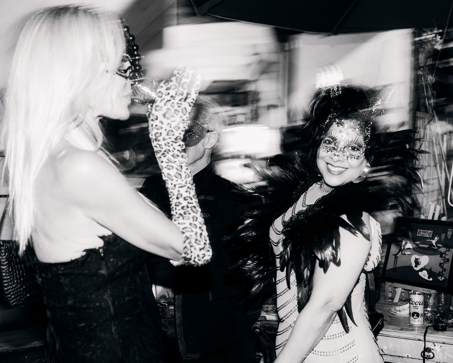 Black and white artistic photo collage showing multiple blurred and overlapping party scenes.