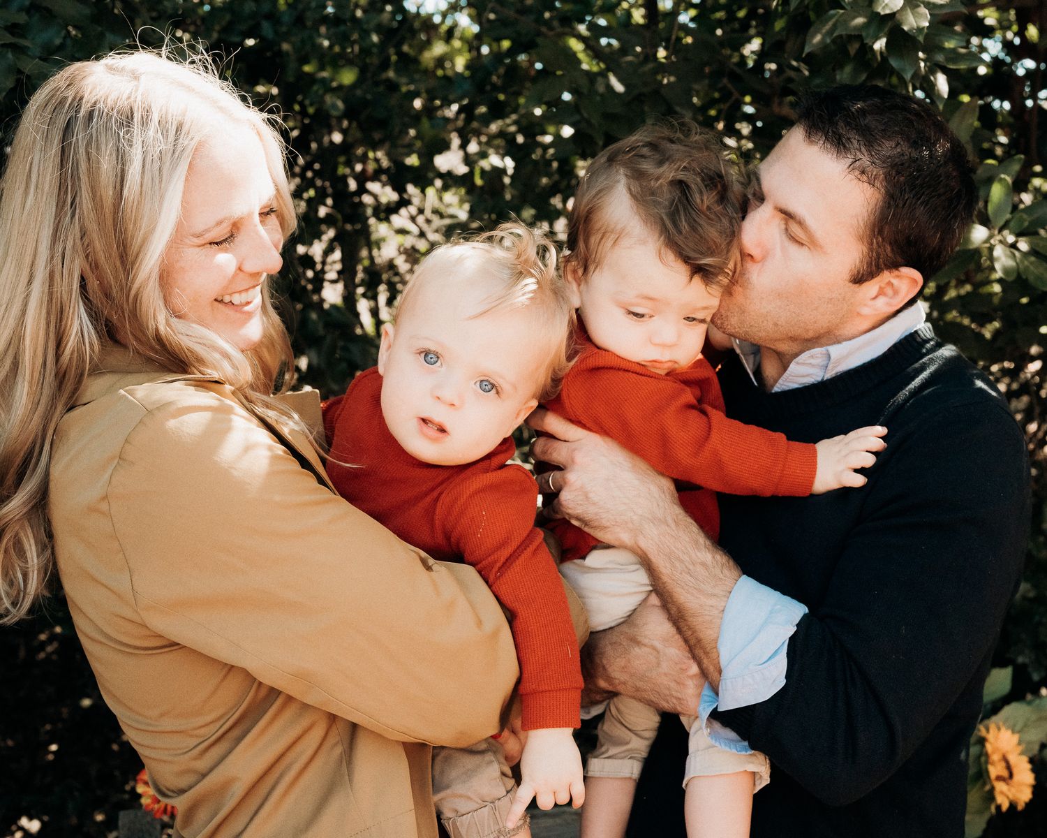 A series of candid family photos showing tender moments between parents and child in an outdoor autumn setting.