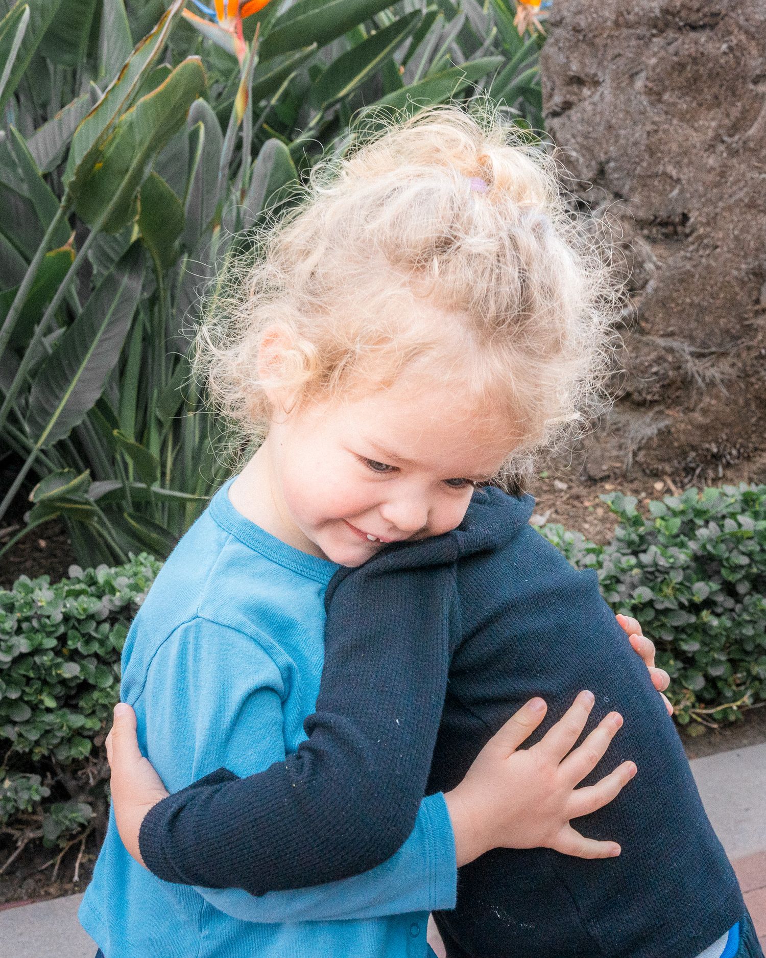 A boy and a girl embracing in a hug as toddlers do, full of love. Mariano Alvarez event photography, Newport Beach, CA