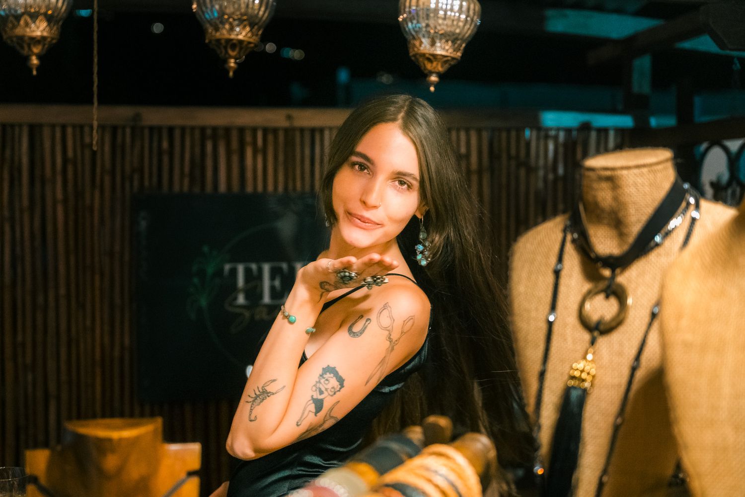 A series of candid photos with warm amber lighting show someone posing and smiling in various casual settings.