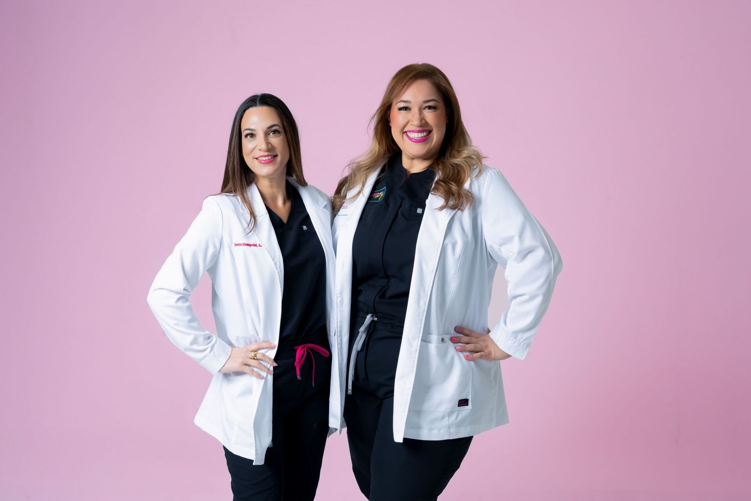 Professional branding portrait of two healthcare professionals on a pink backdrop.