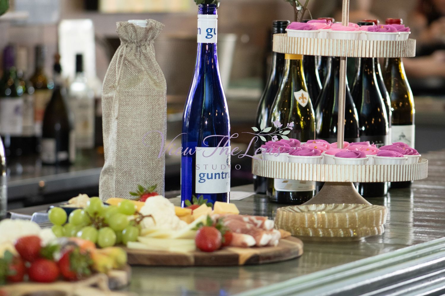 Cupcake display and refreshments at a community event photographed by View The Lens Studio.