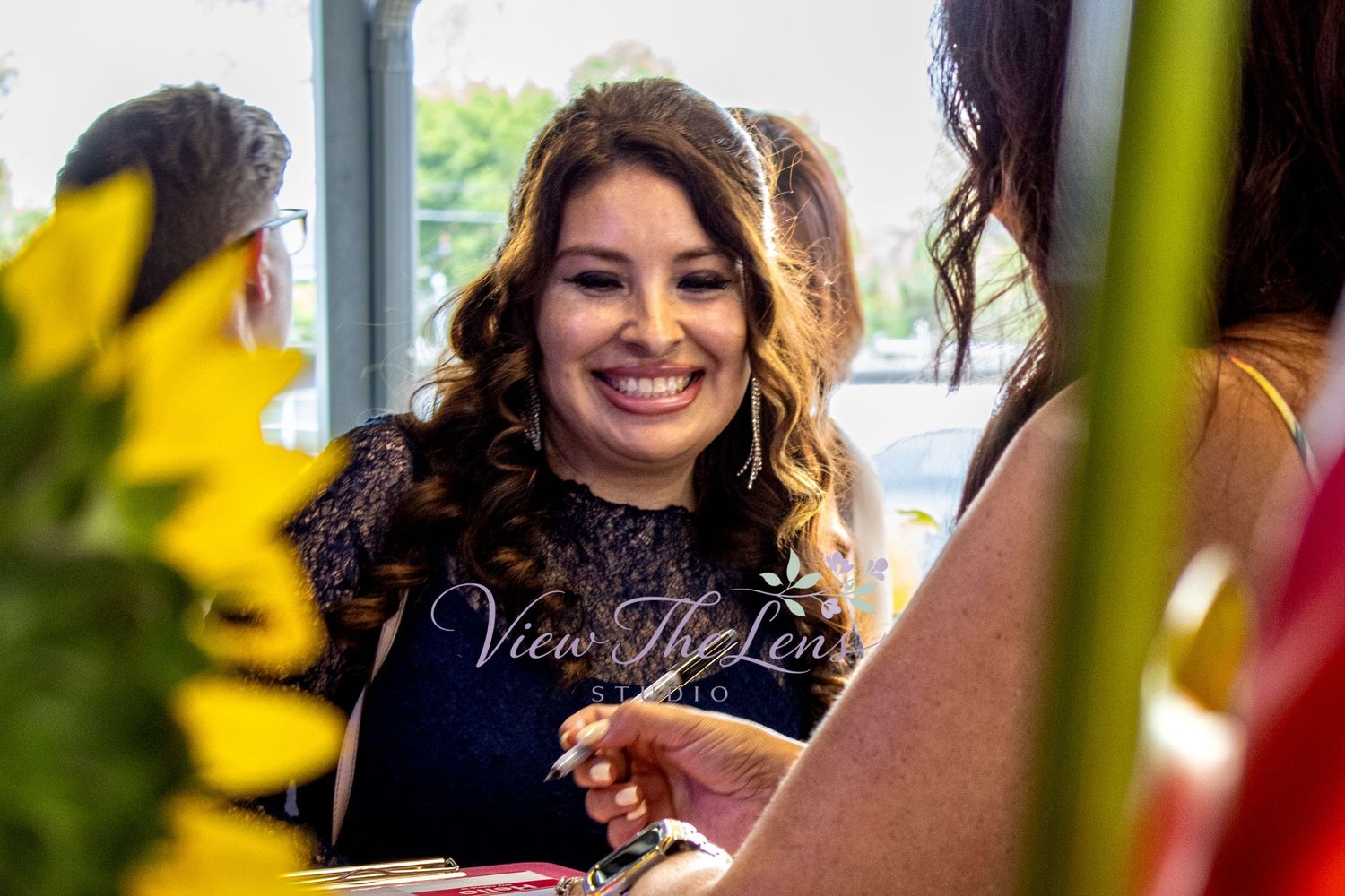 Professional networking event attendee connecting with community members, photographed by View The Lens Studio.