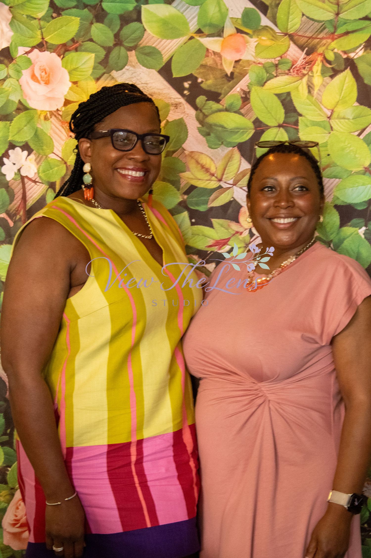 Portrait of two guests celebrating together at a community event.